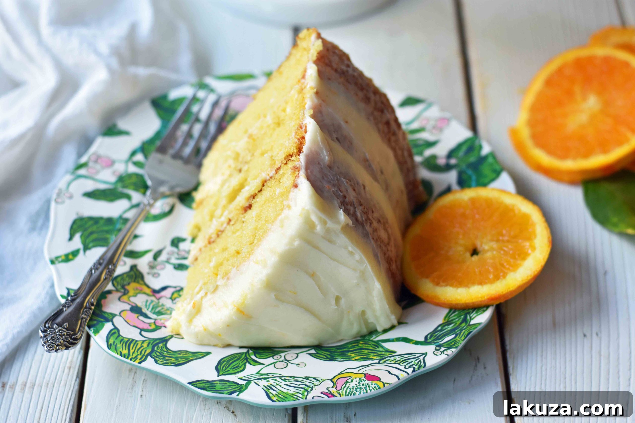 Zesty Orange Dream Cake 19 Homemade Orange Cake with Sweet Orange Cream Cheese Frosting. How to make the best orange cake. Orange cake with orange frosting. Naked orange cake. www.modernhoney.com #cake #orangecake #nakedcake #nakedorangecake