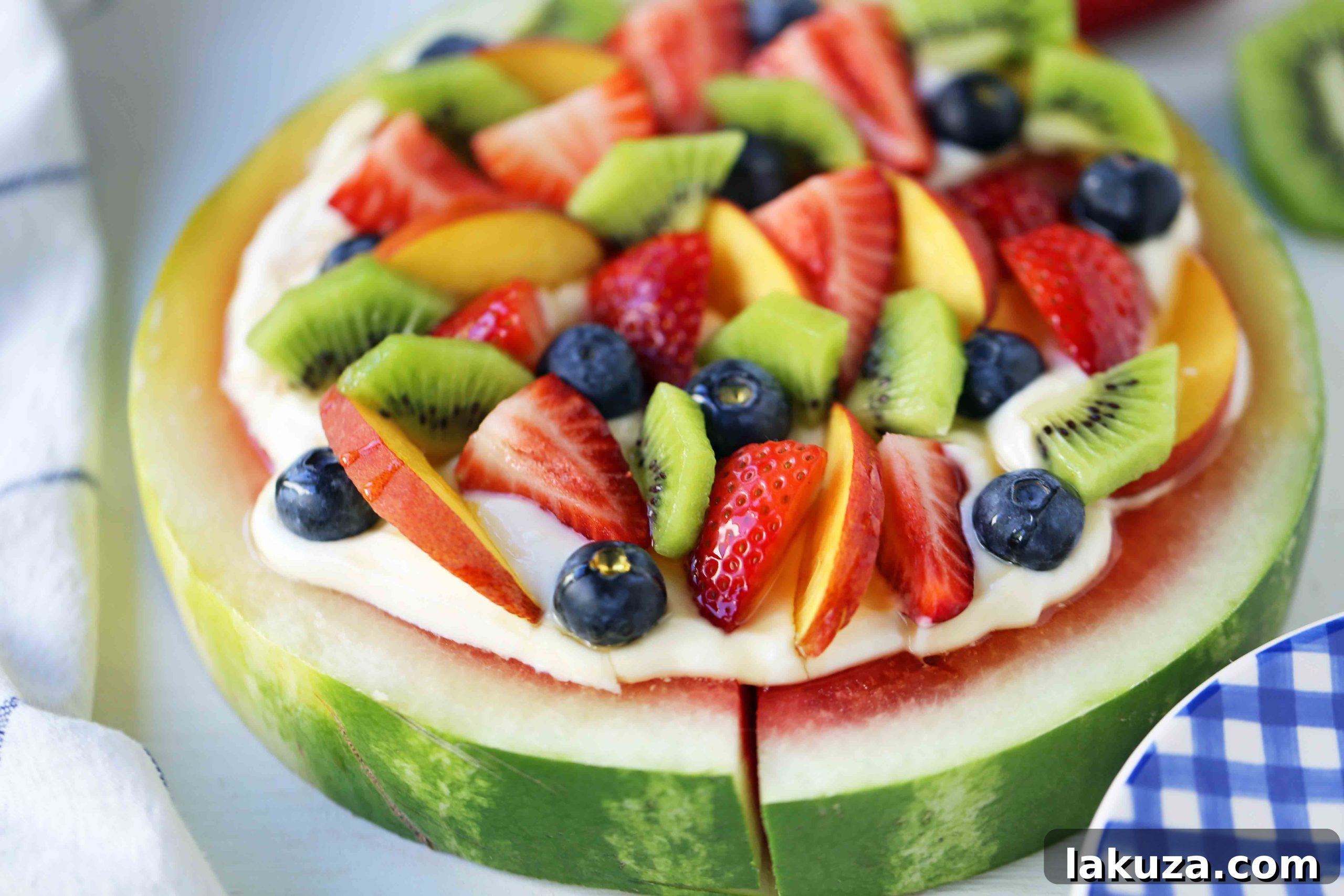 Watermelon Fruit Pizza Cake. A healthy, no-guilt summer dessert recipe. Fresh fruit dessert. The ultimate watermelon and fresh fruit dessert. www.modernhoney.com #fruit #fruitdessert #freshfruit #summer #summerdessert