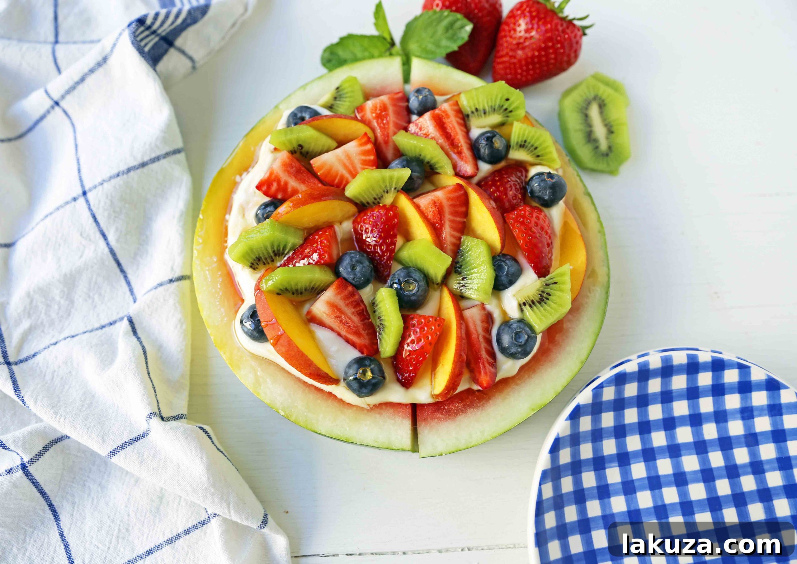 Watermelon Fruit Pizza Cake. A healthy, no-guilt summer dessert recipe. Fresh fruit dessert. The ultimate watermelon and fresh fruit dessert. www.modernhoney.com #fruit #fruitdessert #freshfruit #summer #summerdessert