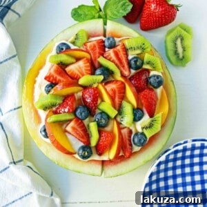 Watermelon Fruit Pizza Cake. A healthy, no-guilt summer dessert recipe. Fresh fruit dessert. The ultimate watermelon and fresh fruit dessert. www.modernhoney.com #fruit #fruitdessert #freshfruit #summer #summerdessert