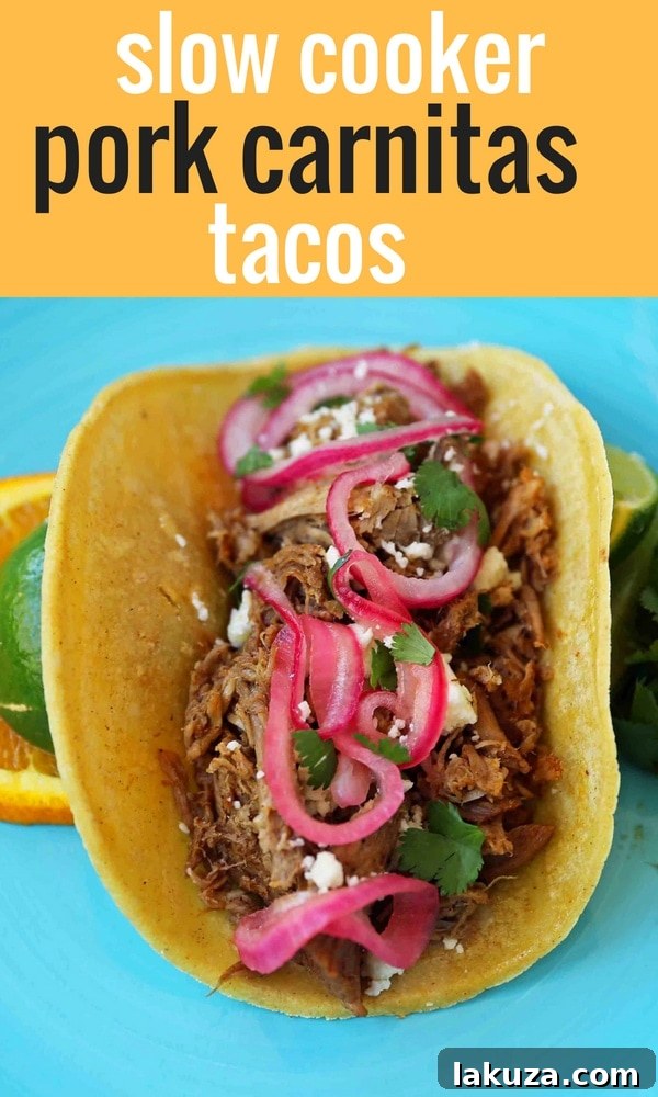 A beautifully presented, rustic platter of Mexican Pork Carnitas Tacos, adorned with fresh cilantro, creamy avocado, and zesty pickled red onions, invitingly ready to be enjoyed.