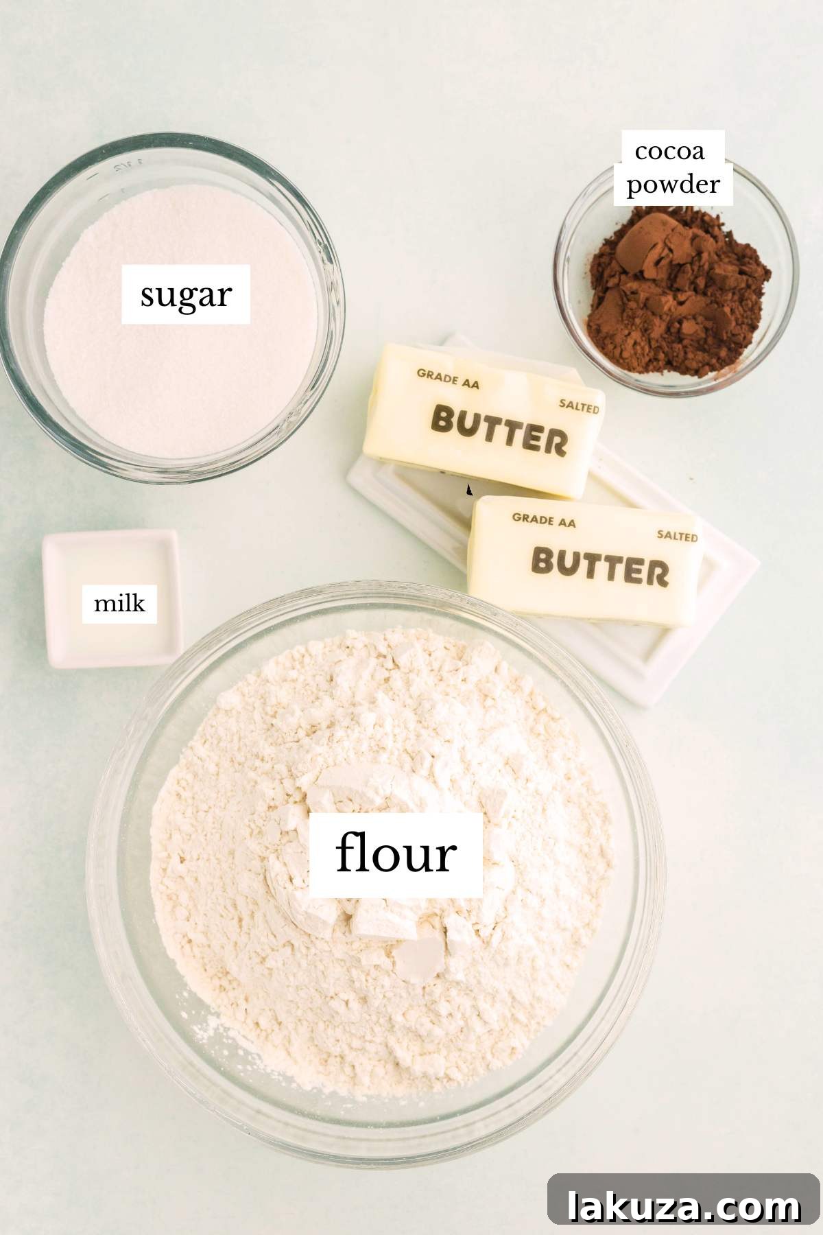 Ingredients for chocolate marble shortbread, neatly laid out on a white kitchen counter and clearly labeled.