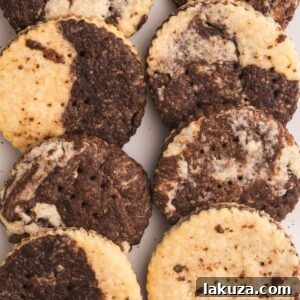 Close-up of round marble shortbread cookies, showcasing the beautiful chocolate and vanilla swirls.