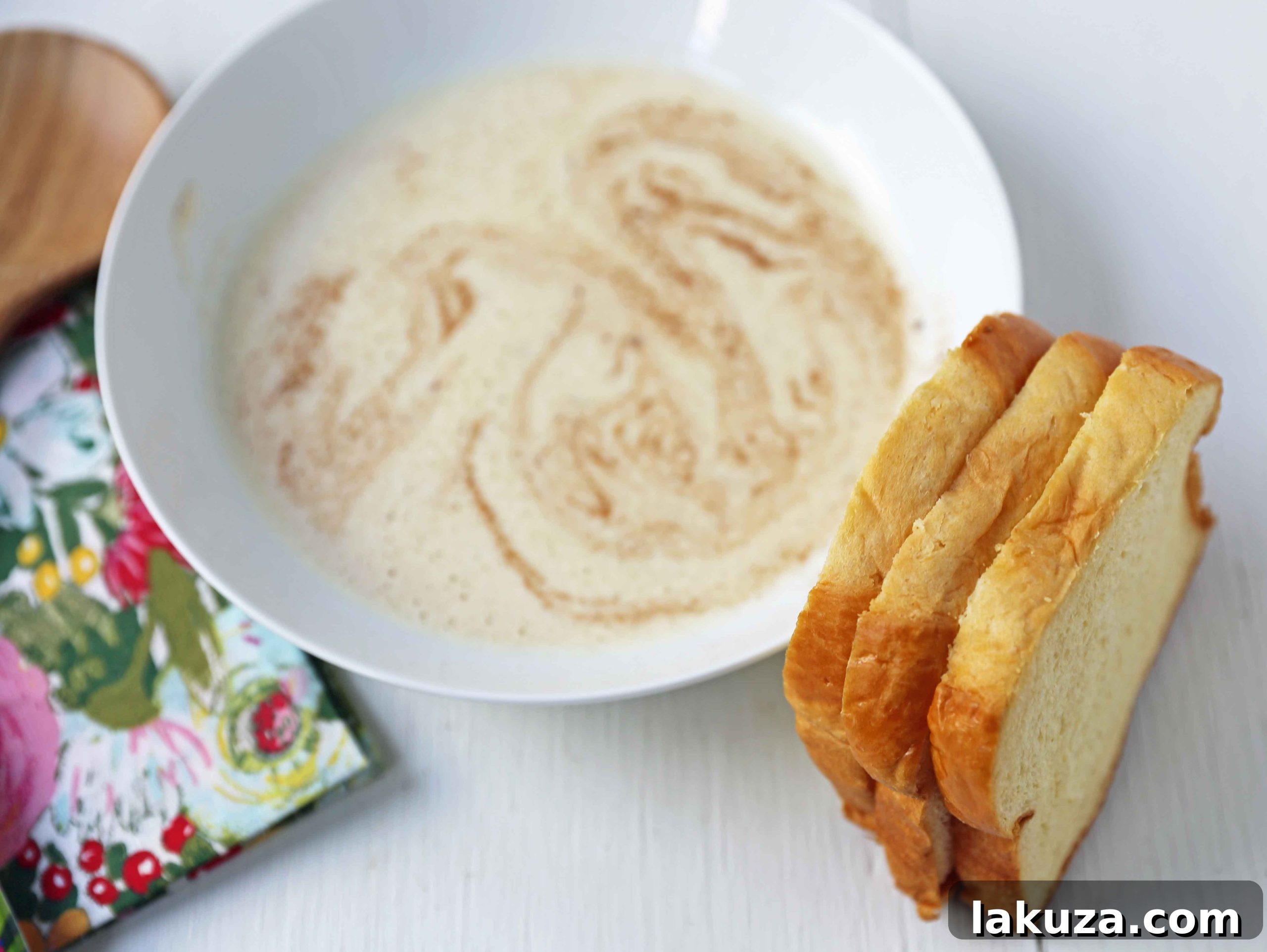 Vanilla Bean French Toast 4 Thick brioche bread slices soaking in a creamy vanilla custard batter