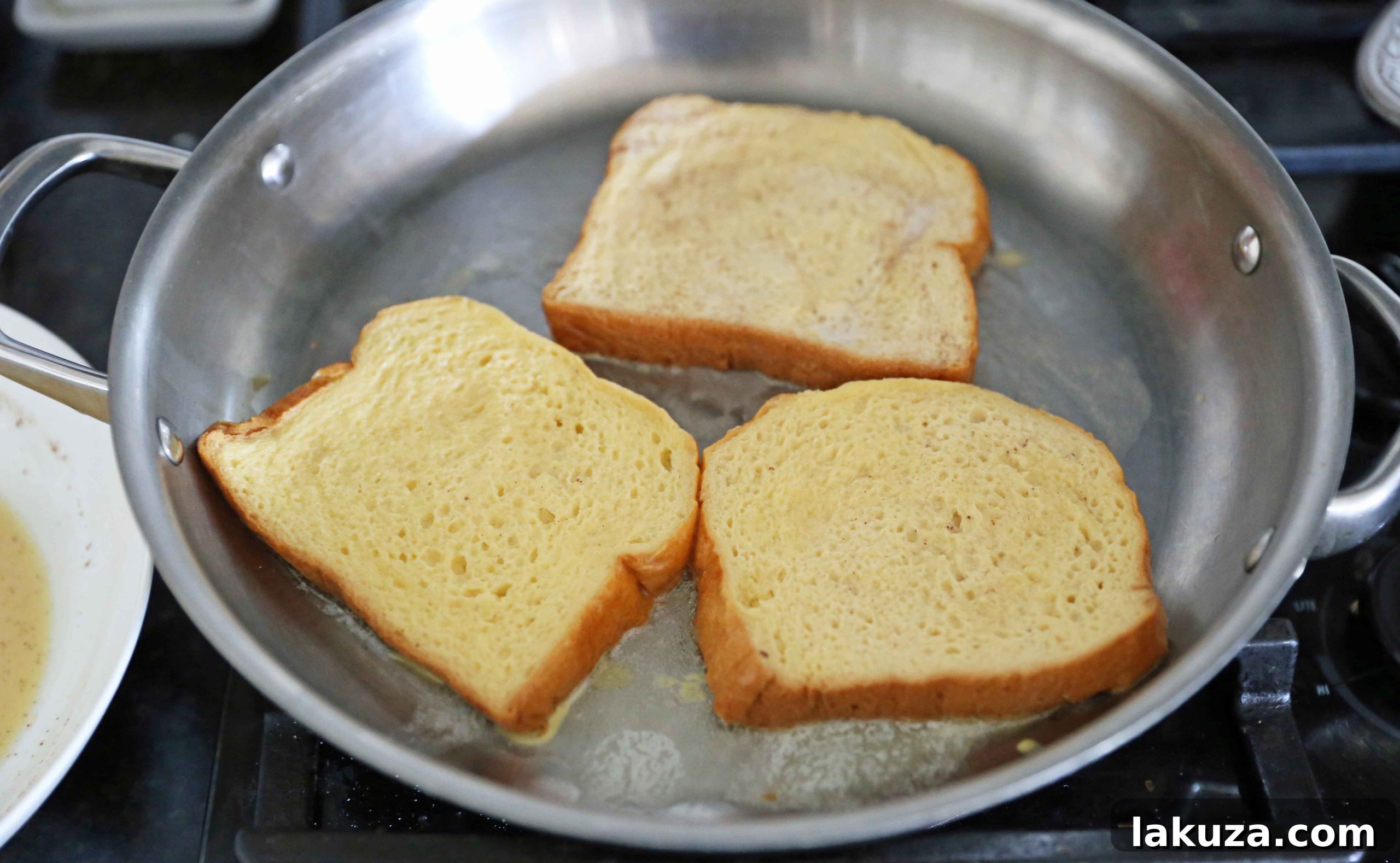 Vanilla Bean French Toast 5 French Toast sizzling on a hot griddle, ready to be flipped