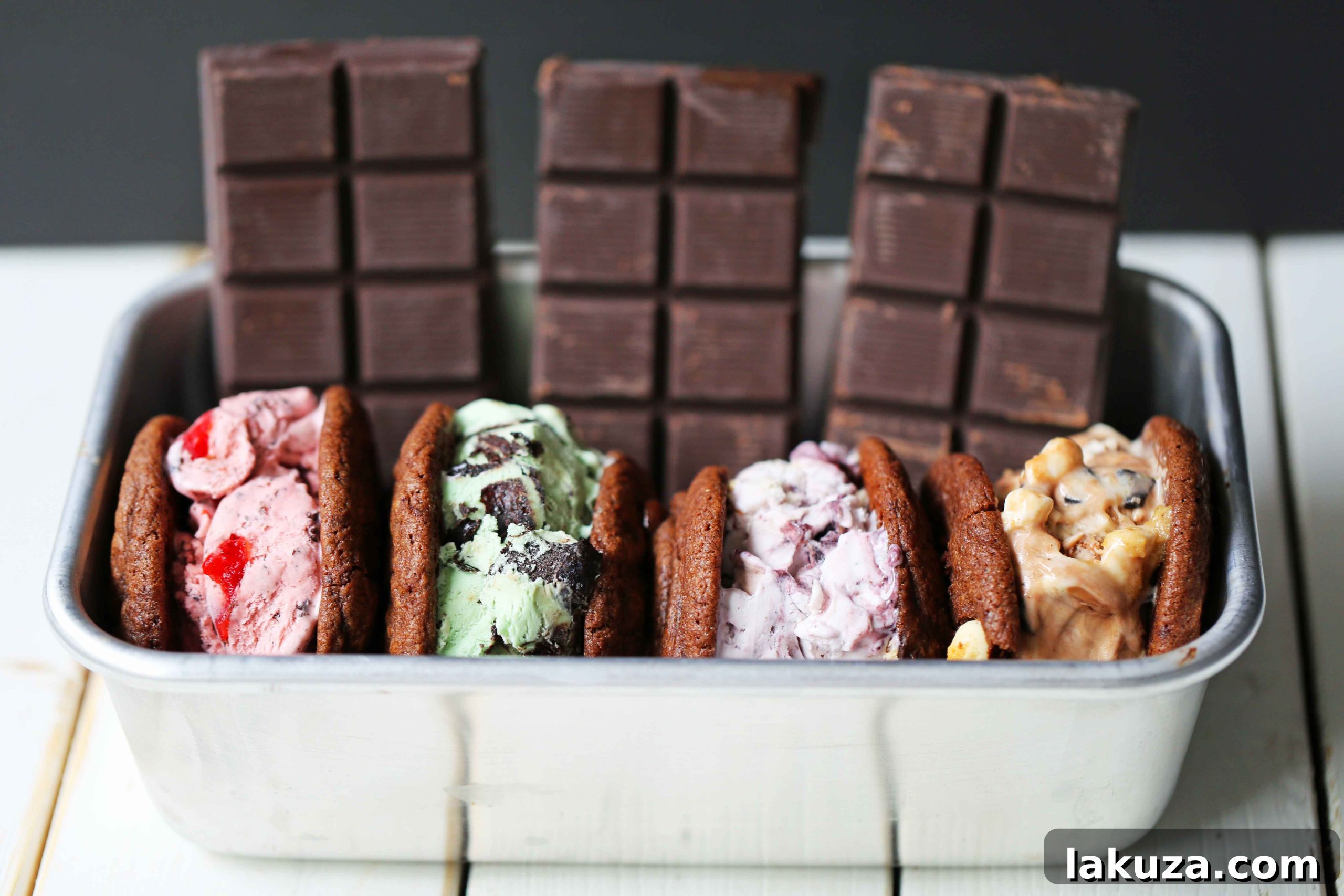 Homemade Chocolate Ice Cream Sandwiches. Perfectly soft and chewy chocolate chunk cookies filled with creamy ice cream. A delicious and simple recipe for the best summer dessert. Modern Honey food blog.
