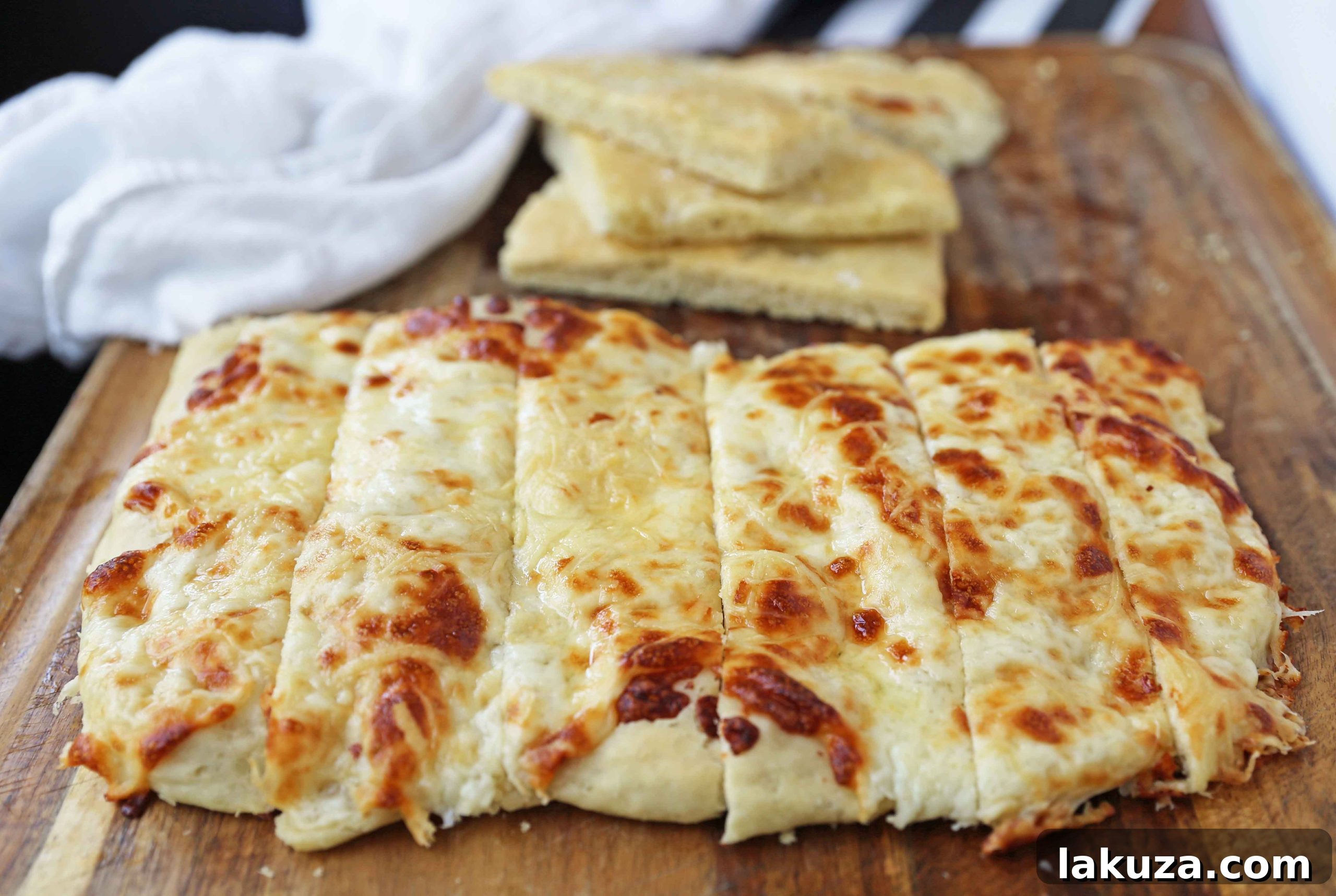 Step-by-step guide to making the best homemade garlic cheese focaccia bread. Easy to follow recipe for delicious Italian focaccia. www.modernhoney.com #focaccia