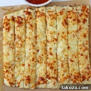 Cheese Focaccia Bread Recipe. How to make garlic cheese focaccia bread from scratch. The best garlic cheese breadsticks. www.modernhoney.com #focaccia