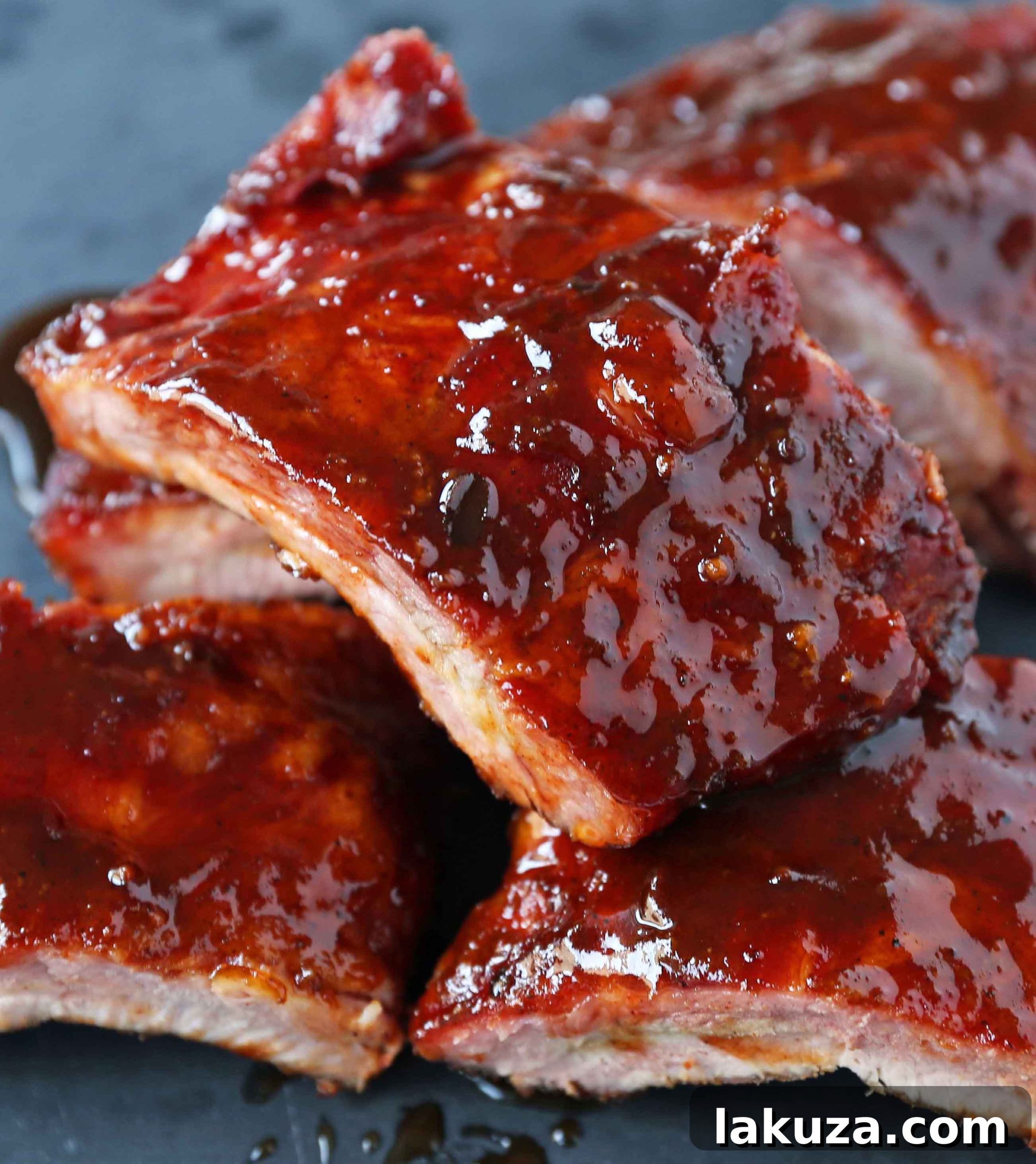 Smoked Baby Back Ribs. Tender, flavorful, fall-off-the-bone Pork Baby Back Ribs. How to smoke ribs or cook in the oven. Perfect BBQ Rub Recipe. #ribs #babybackribs