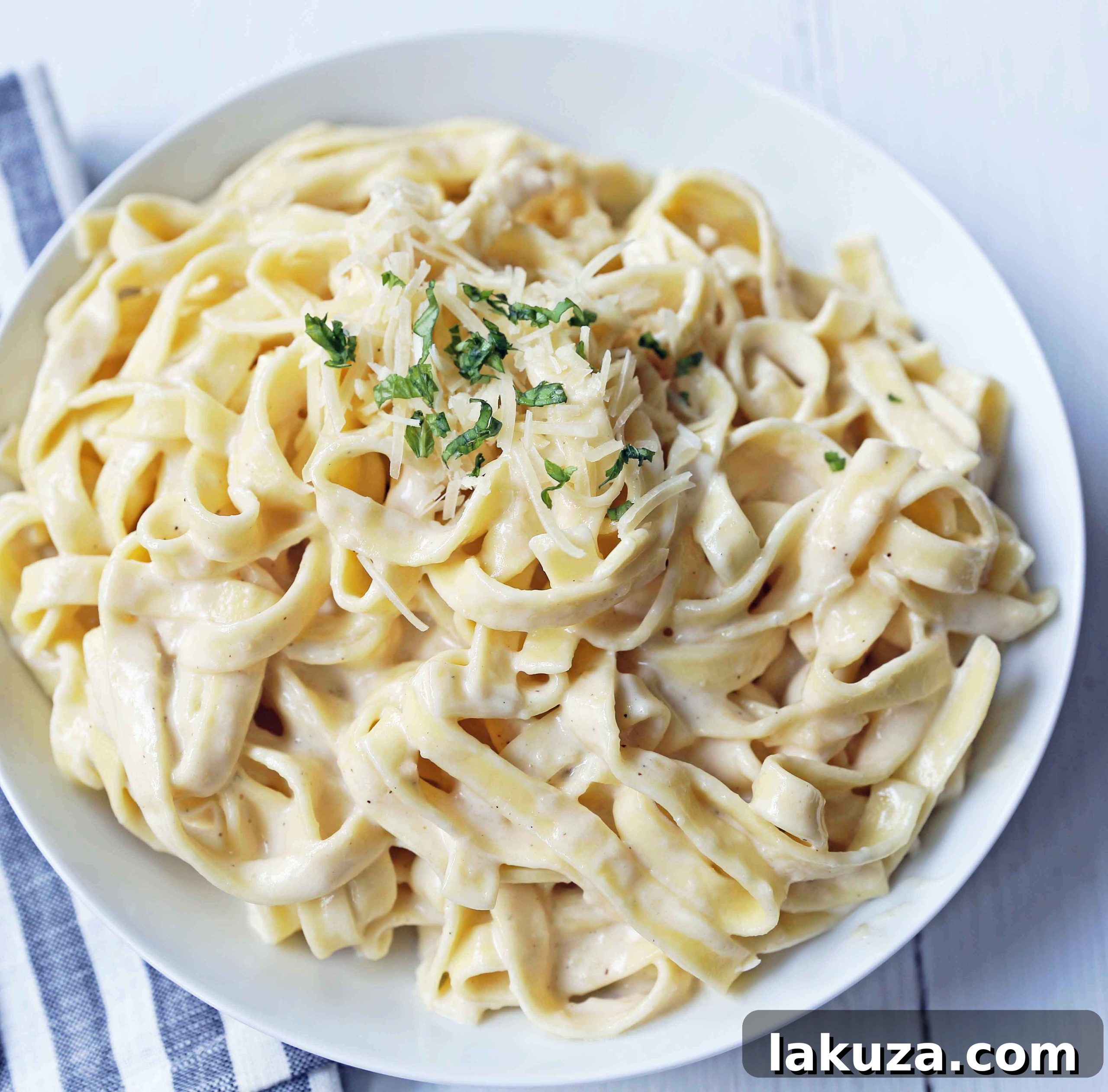 Classic Homemade Fettuccine Alfredo: A rich and creamy pasta dish made from scratch with heavy cream, butter, parmesan cheese, and a hint of garlic. The ultimate comfort food recipe.
