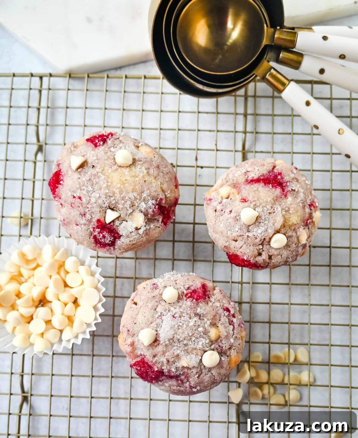 Decadent Raspberry White Chocolate Muffins 4 Fresh, vibrant raspberries and sweet white chocolate chips arranged, ready to be incorporated into a delicious muffin batter.