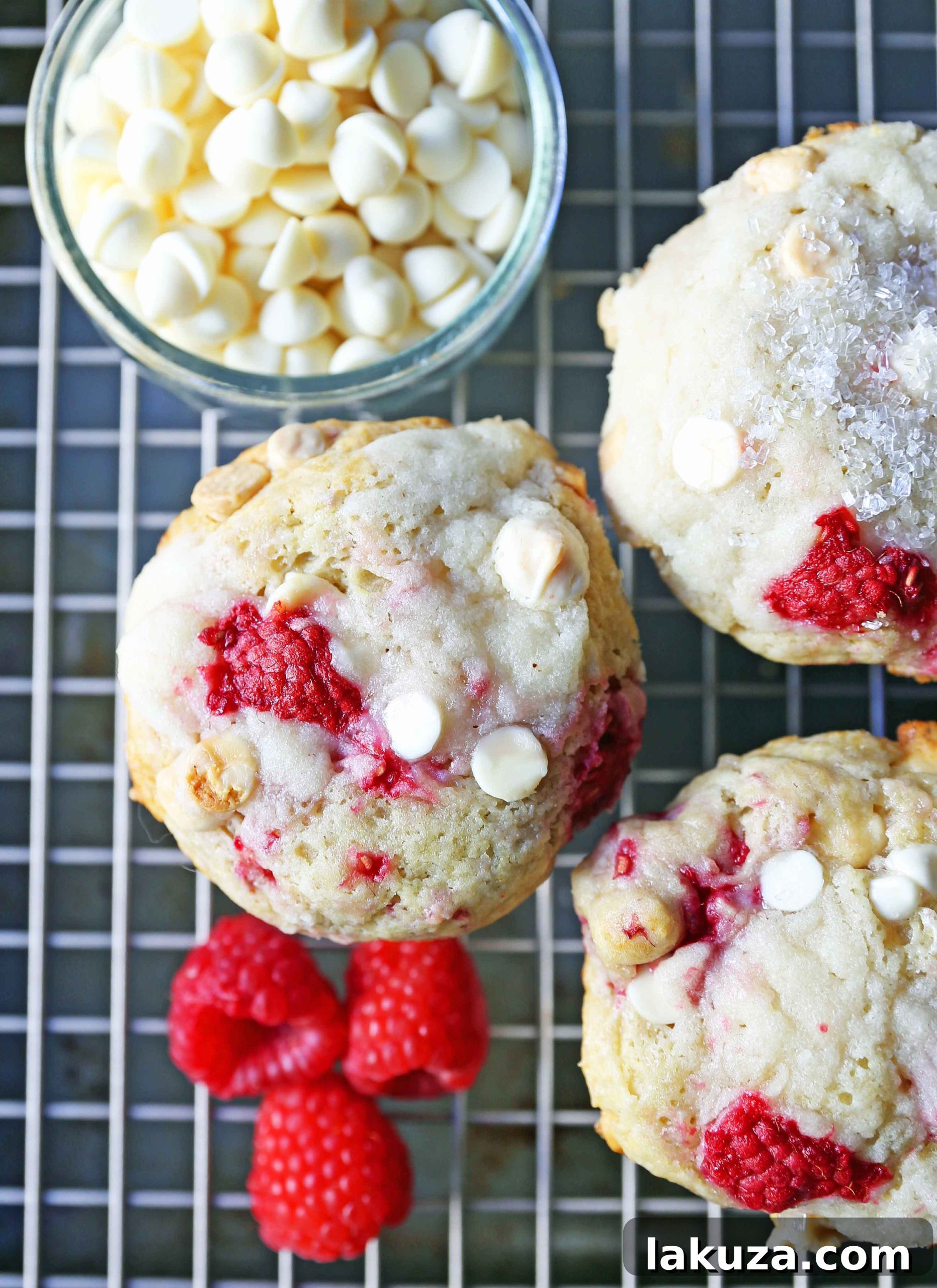 Decadent Raspberry White Chocolate Muffins 8 A visually appealing stack of freshly baked Raspberry White Chocolate Muffins, perfectly golden and ready for serving.