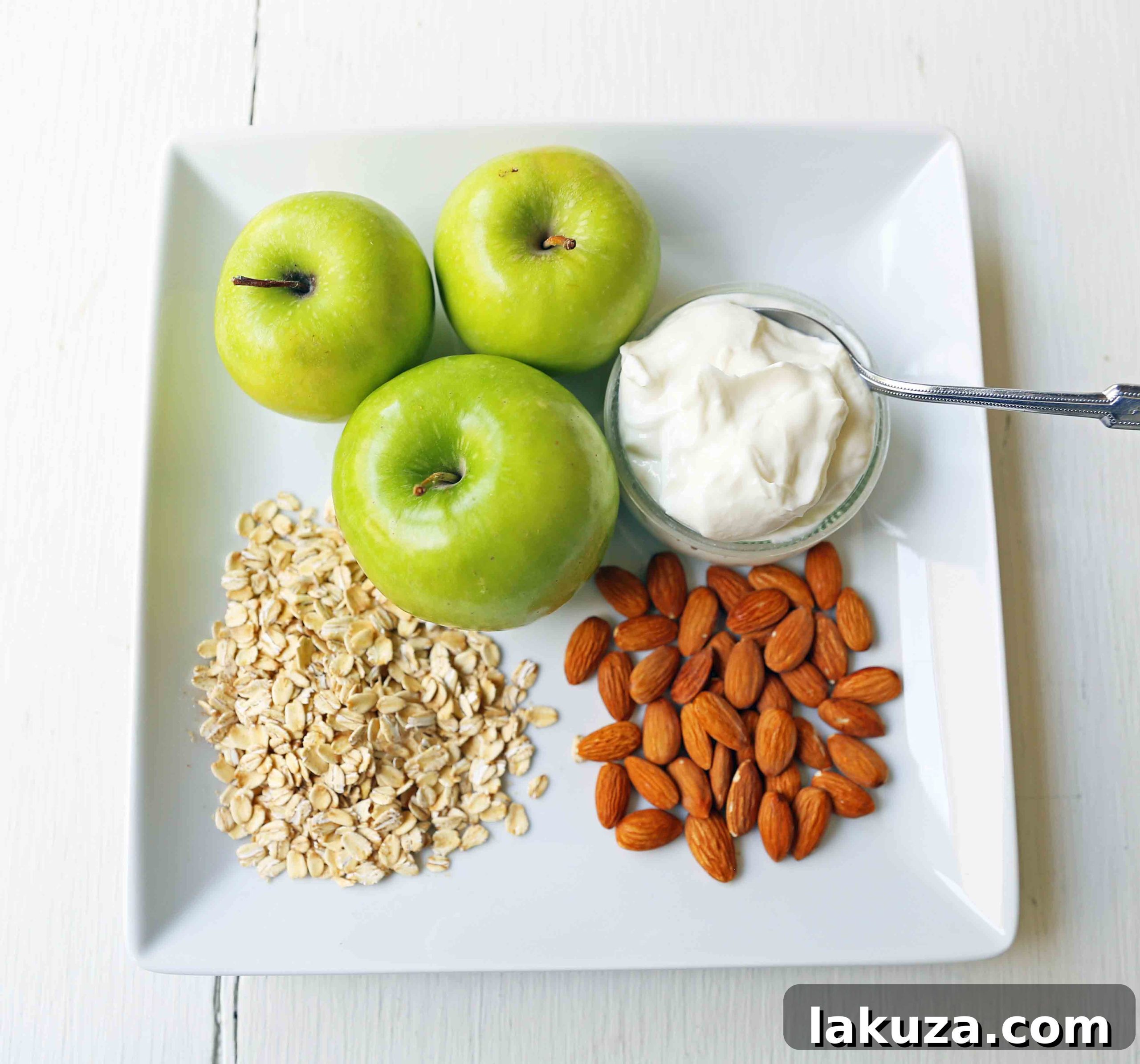 Greek Yogurt Green Apples Almonds and Rolled Oats. Apple Pie Overnight Oats. Healthy no-sugar-added breakfast. Overnight Oats with Greek Yogurt, Crisp Green Apples, Crunchy Almonds, Cinnamon, and Real Maple Syrup. www.modernhoney.com #overnightoats #applepieovernightoats #appleovernightoats 