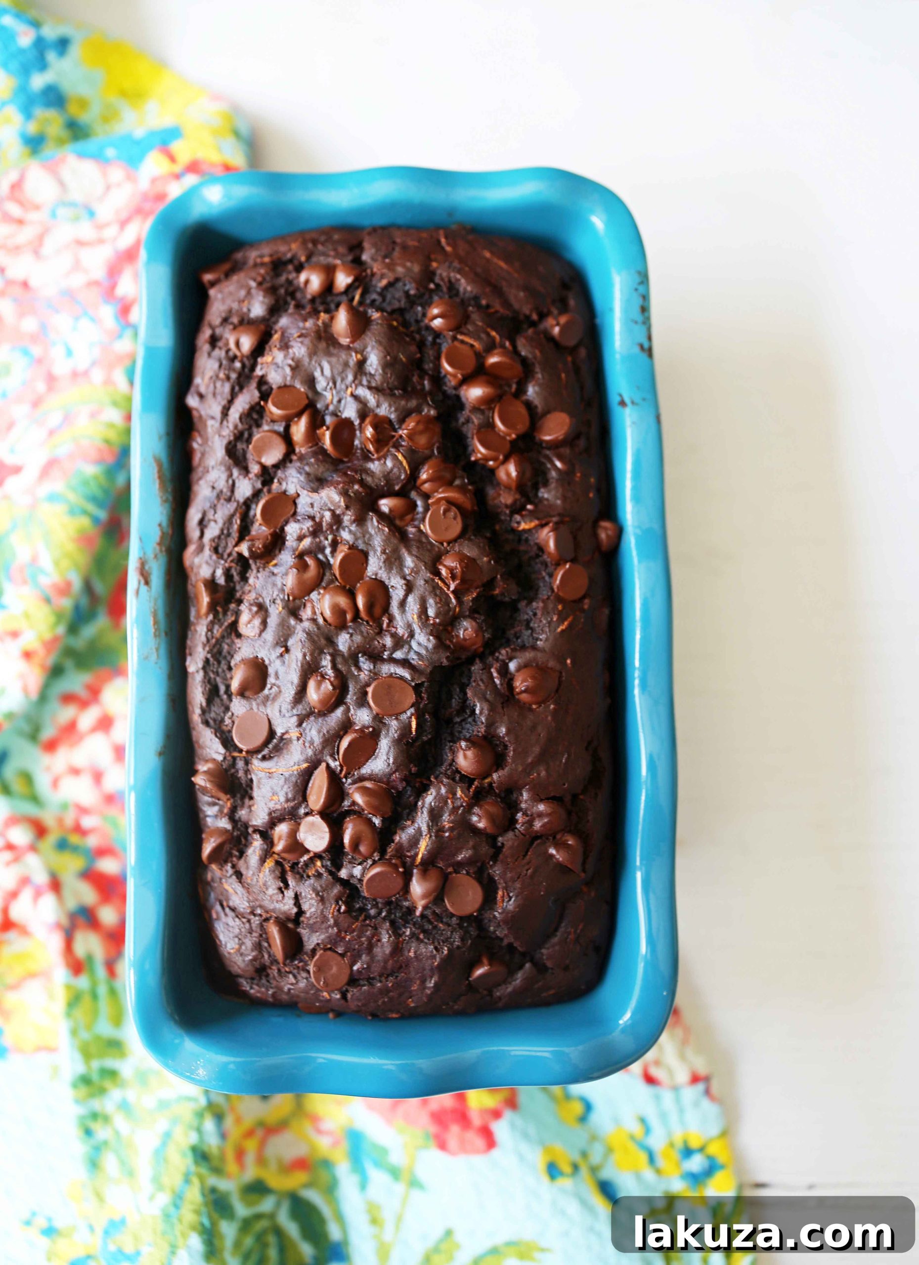 Chocolate Zucchini Bread. A rich double chocolate zucchini bread with chocolate chips recipe. You will never know there is zucchini in this chocolate bread! It is moist, rich, and a chocolate lover's dream! www.modernhoney.com #zucchinibread #chocolatezucchinibread #zucchinirecipes