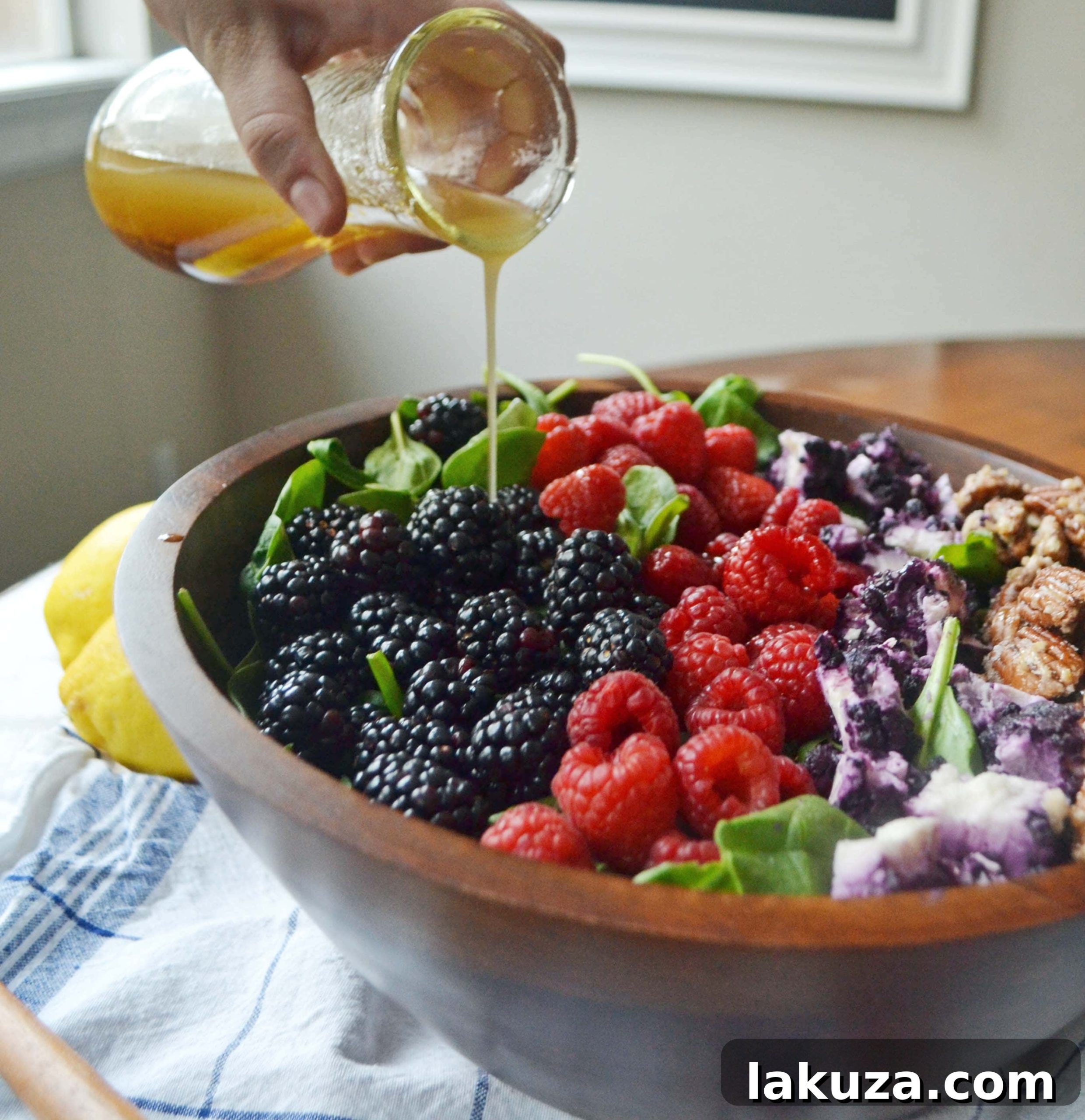 Simple & Fresh Berry Candied Pecan Salad Ingredients Fresh ingredients for Berry Candied Pecan Salad, showcasing berries and greens