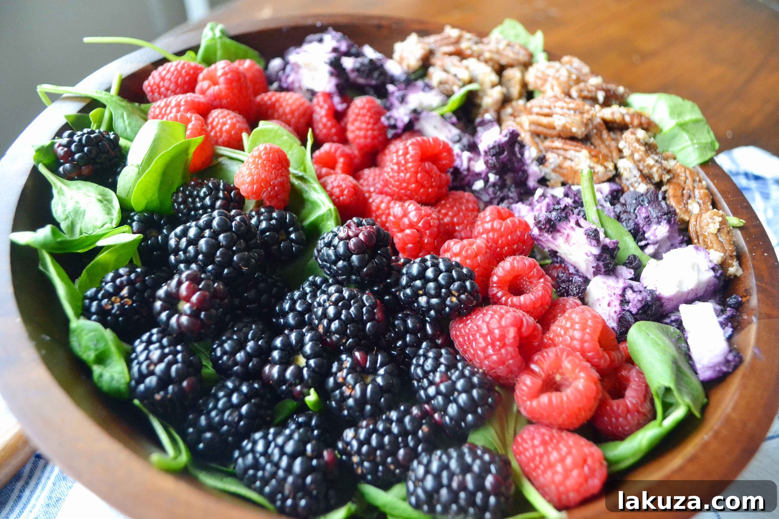 Sweet Berry Pecan Salad with Zesty Lemon Vanilla Bean Vinaigrette 2 Close-up of creamy blueberry goat cheese for Berry Candied Pecan Salad