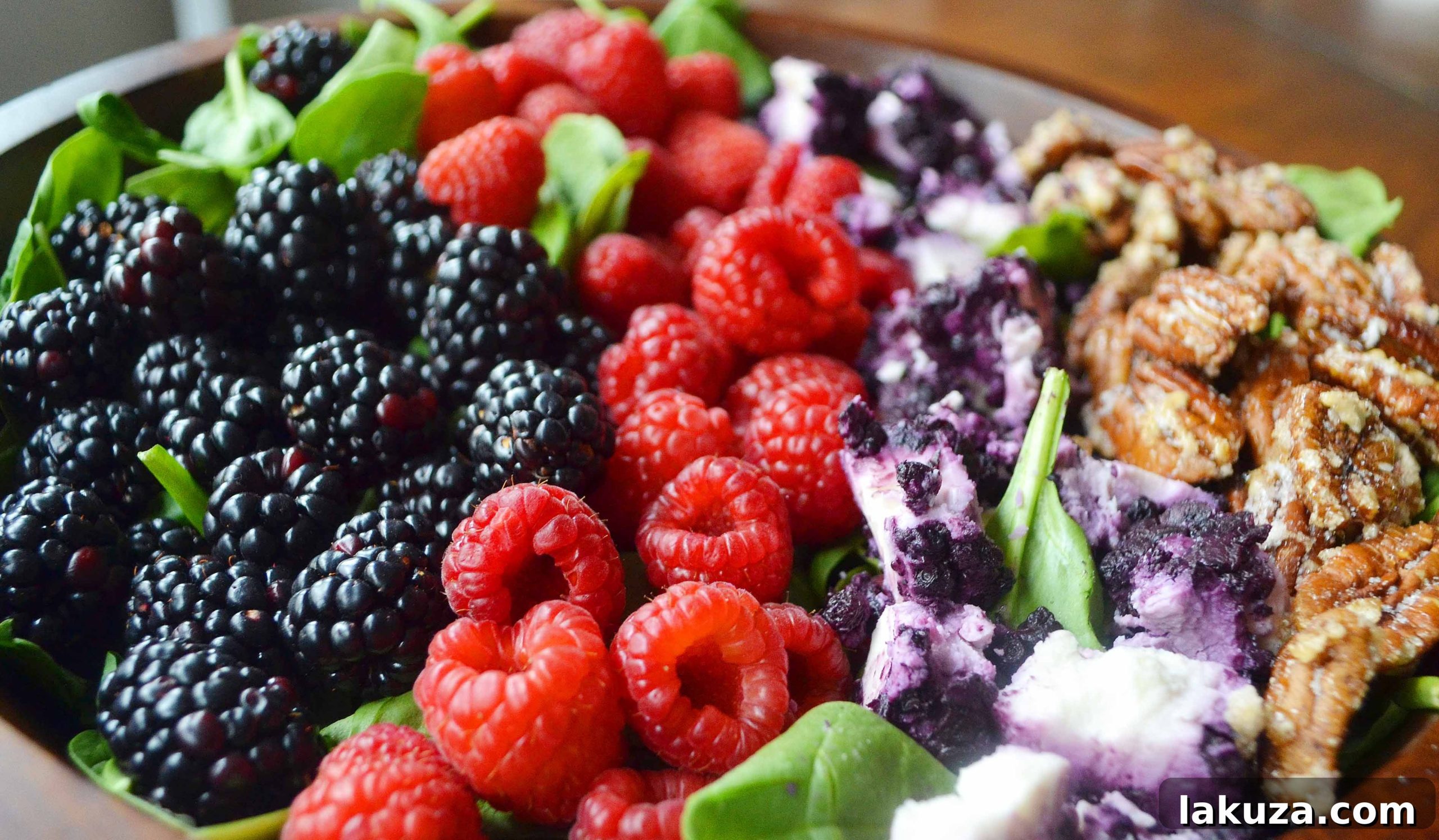 Sweet Berry Pecan Salad with Zesty Lemon Vanilla Bean Vinaigrette 4 Close-up view of Berry Candied Pecan Salad, highlighting the berries and nuts
