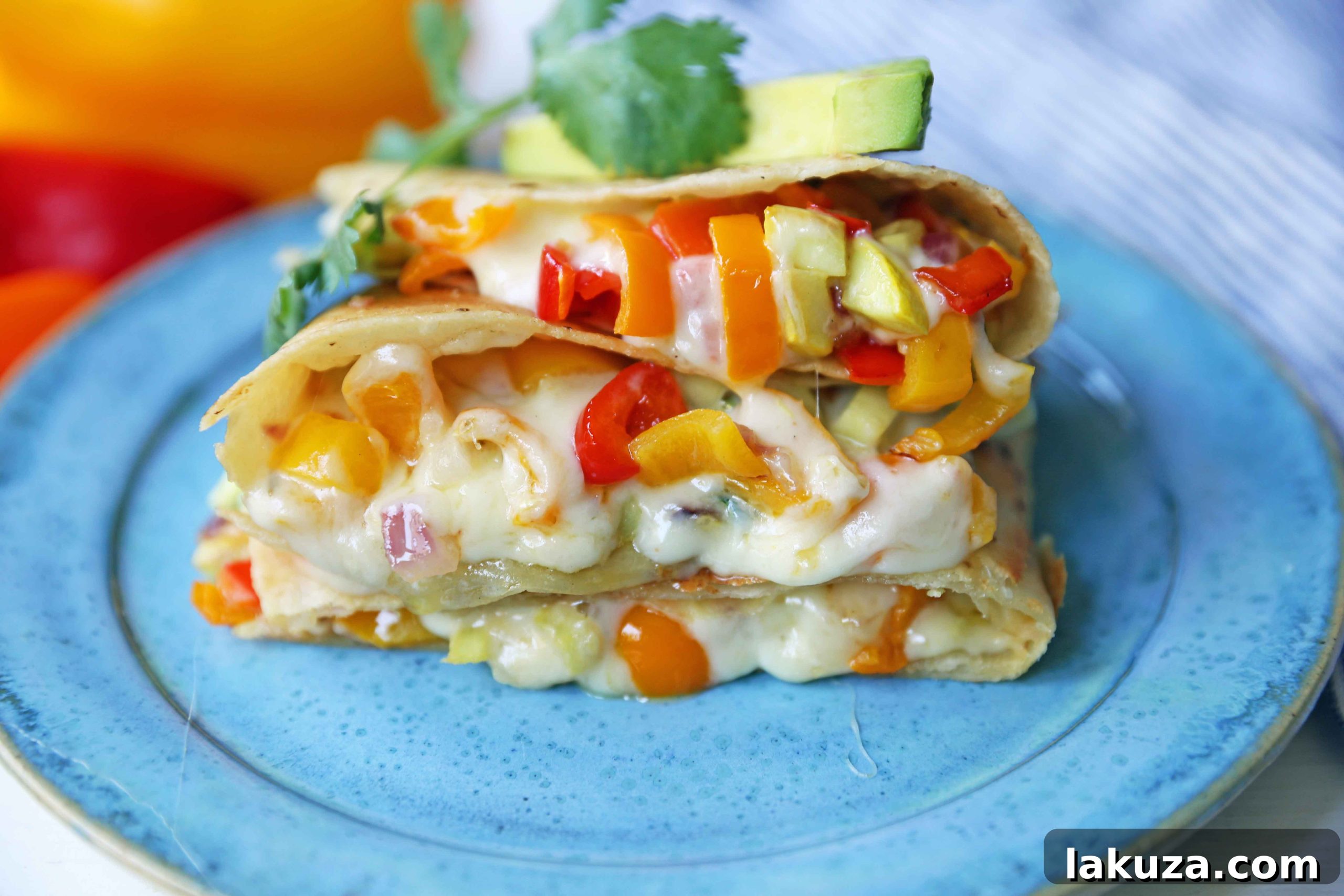 Golden-brown veggie quesadilla showcasing melted cheese and colorful summer vegetables. A perfect vegetarian meal.