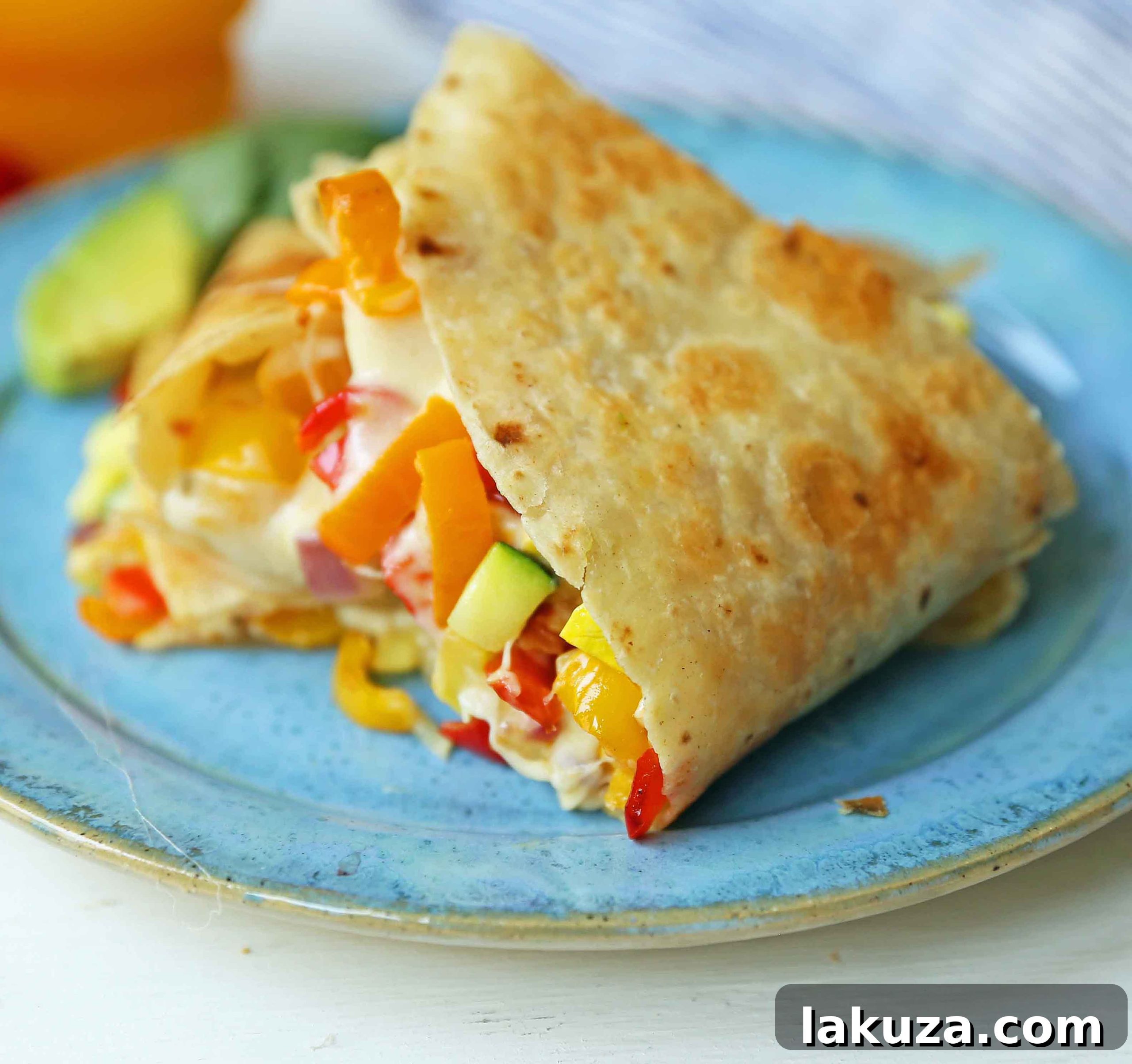 Close-up of a perfectly grilled veggie quesadilla, showing the golden-brown tortilla and melted cheese peeking out. Served with fresh salsa.