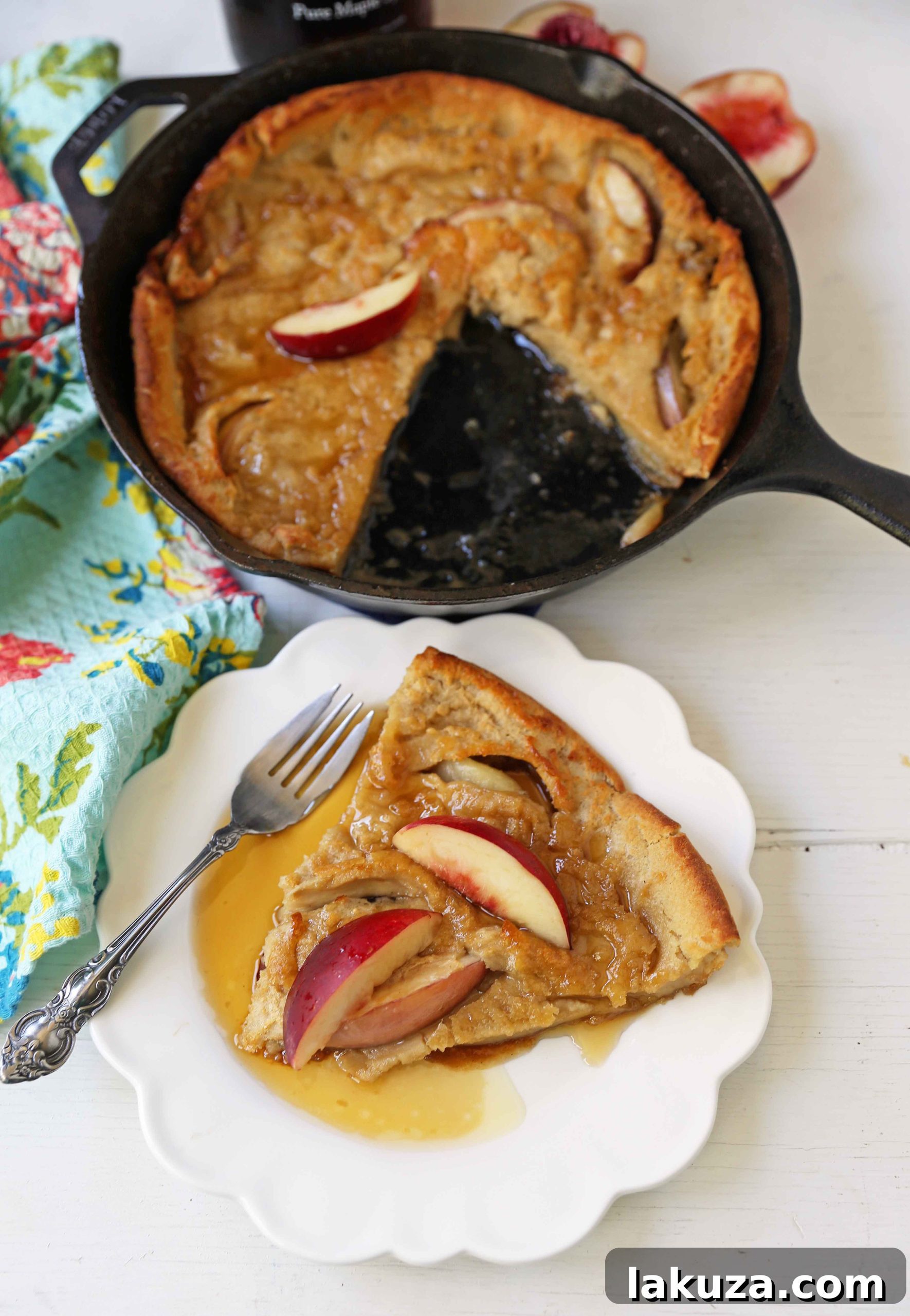 Caramelized Brown Sugar Peach Dutch Baby 3 Close-up of a golden Brown Sugar Peach Dutch Baby with melted butter and glistening peaches