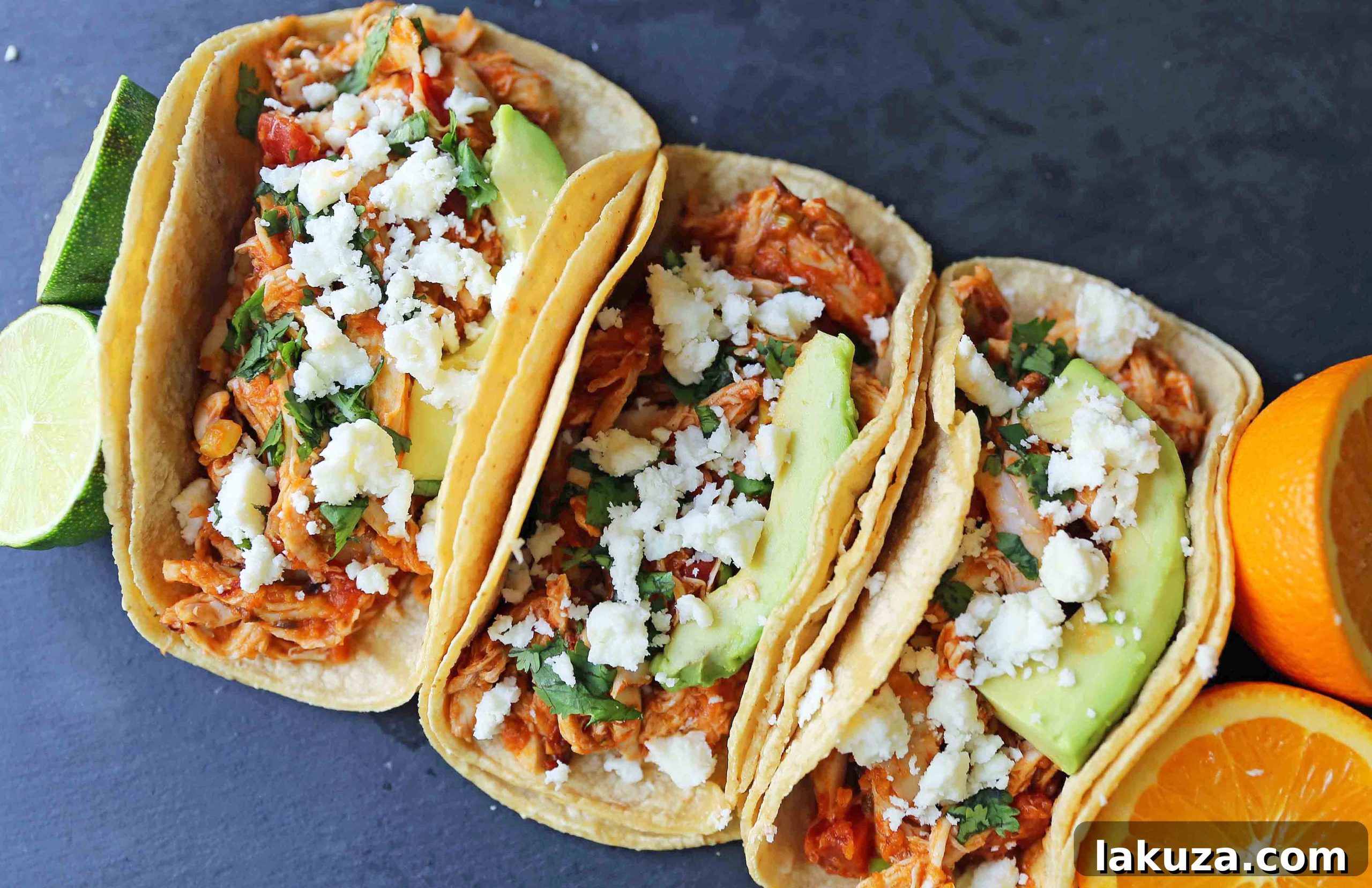 Delicious Chipotle Chicken Tinga Tacos with fresh toppings. This quick and easy chicken taco recipe features tender shredded chicken in a smoky, spicy tomato-chipotle sauce, perfect for a one-skillet weeknight meal.