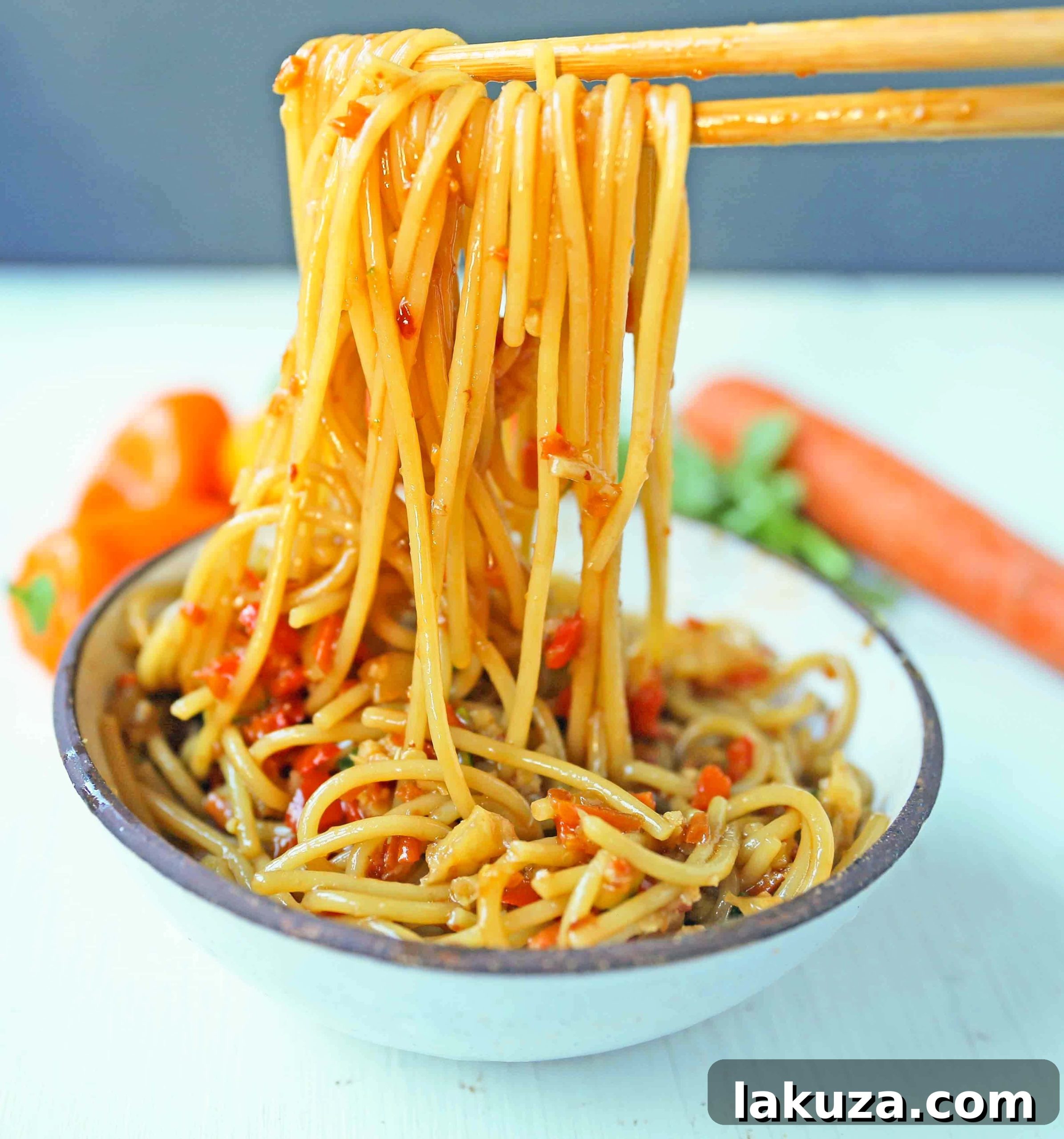 Vibrant Asian Noodle Stir-Fry 4 Close-up of Asian Vegetable Stir-Fry Noodles. A vibrant medley of healthy fresh vegetables tossed with noodles in a delectable homemade stir-fry sauce. A perfect 20-minute meal solution for a quick and easy family dinner. Modern Honey's Asian Garlic Noodles Recipe. www.modernhoney.com #asiannoodles #garlicnoodles #stirfry #veggiestirfry #asianfood #quickdinner