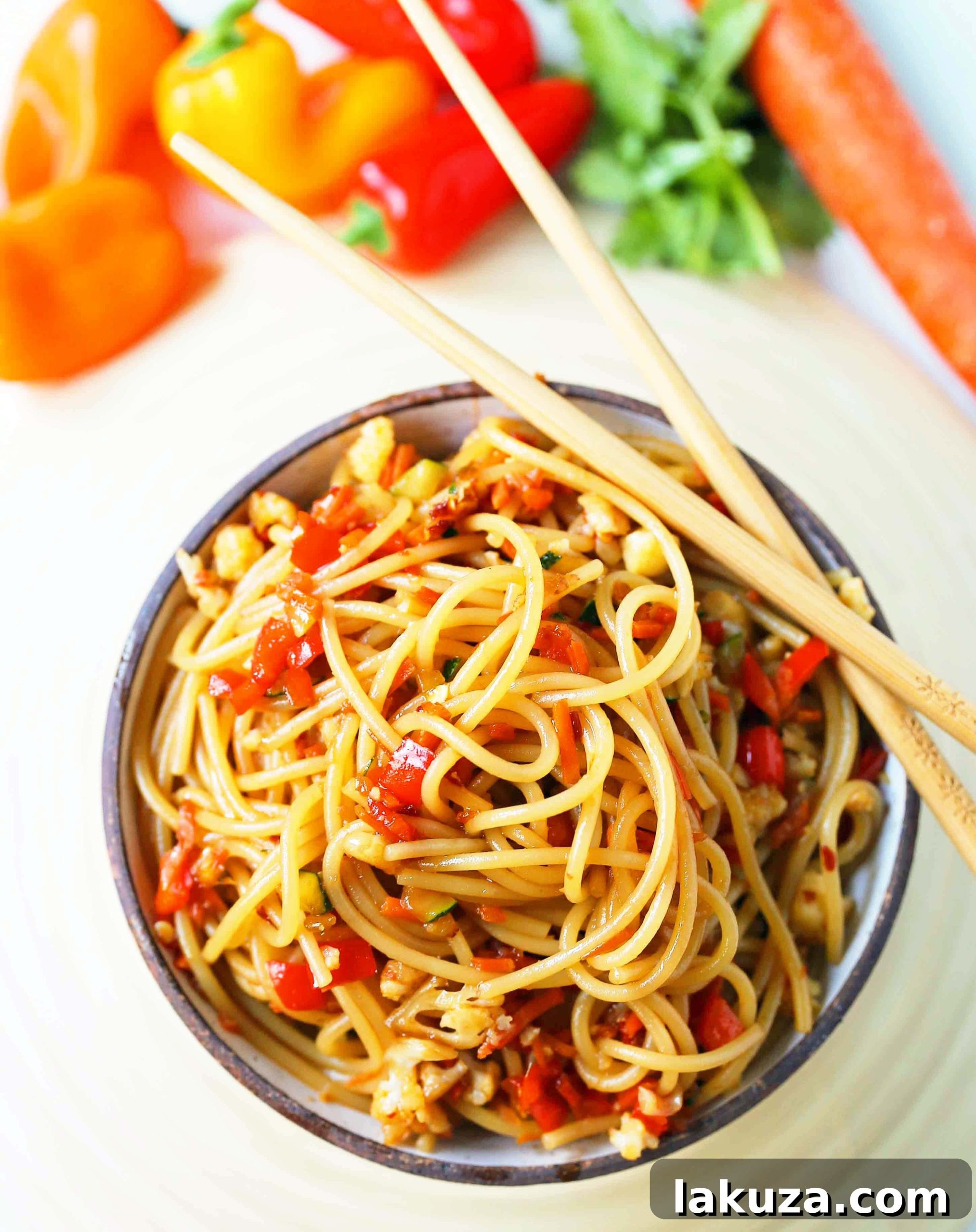Vibrant Asian Noodle Stir-Fry 7 Close-up of fresh Asian Vegetable Stir-Fry Noodles being cooked in a pan. Healthy, vibrant vegetables tossed with noodles in a delicious homemade stir-fry sauce. A quick and easy, 20-minute family dinner, Asian Garlic Noodles Recipe. www.modernhoney.com #asiannoodles #garlicnoodles #stirfry #veggiestirfry #asianfood #cooking