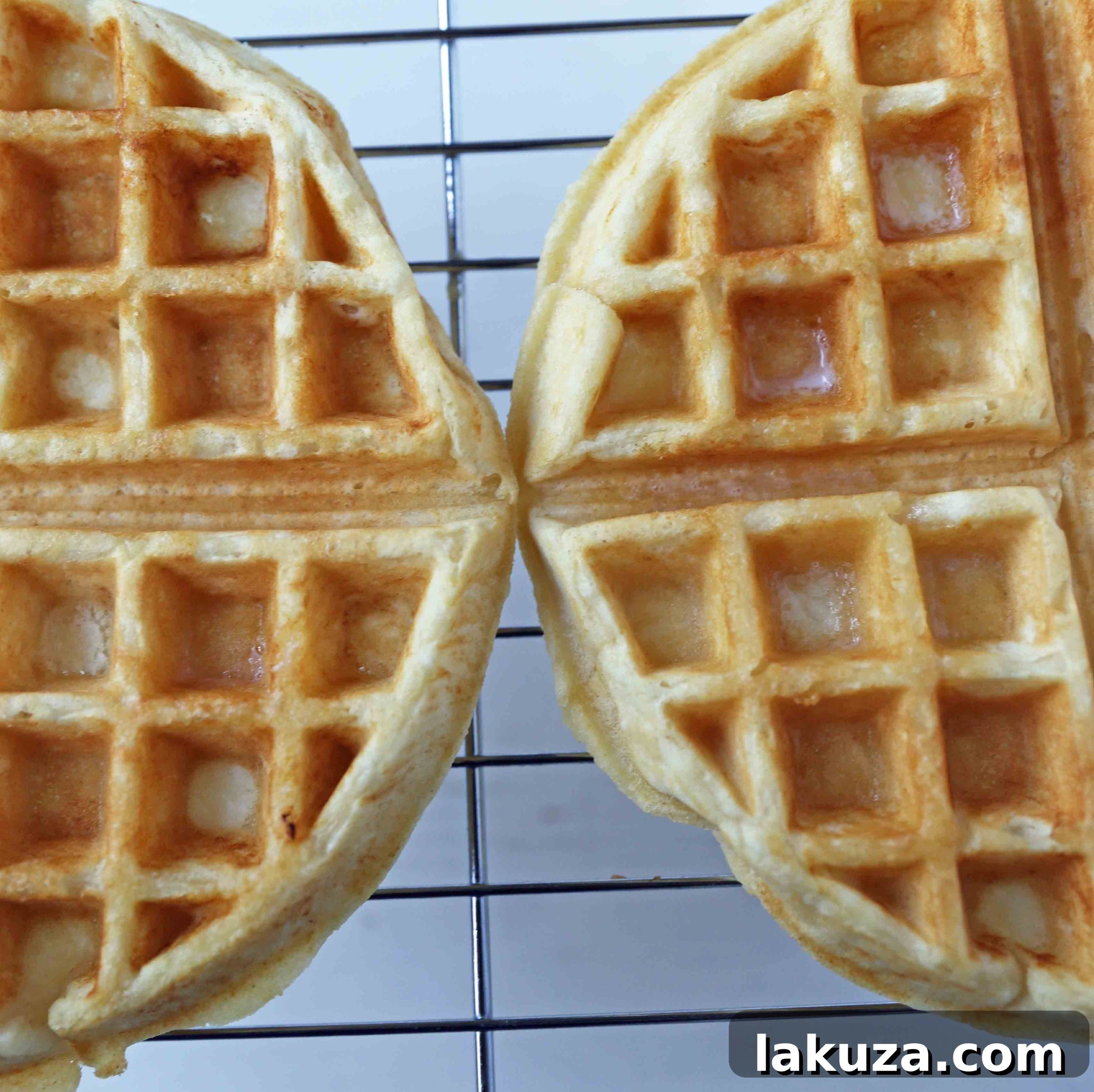 A rustic presentation of One-Bowl Easy Buttermilk Waffles, highlighting their golden brown exterior and readiness for toppings. A simple and quick homemade waffle recipe for delightful meals.