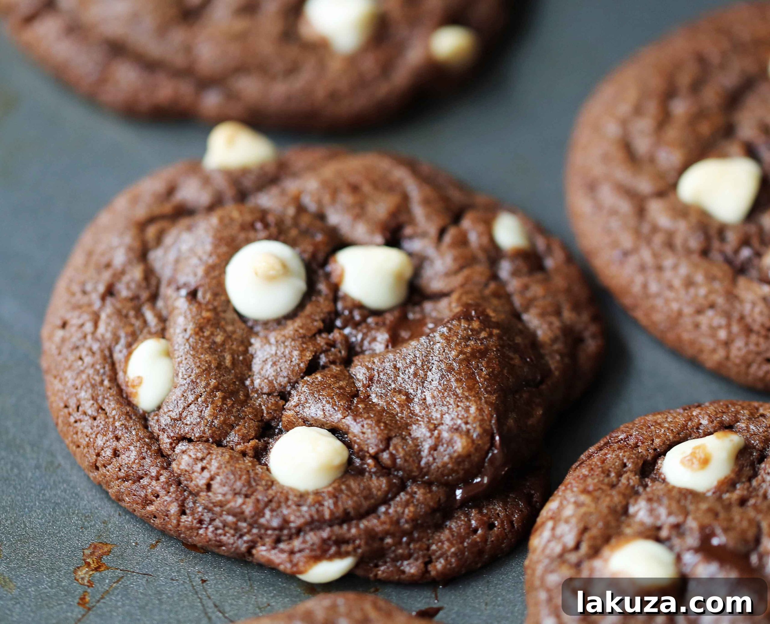 Close-up of a stack of freshly baked Triple Chocolate Chip Cookies