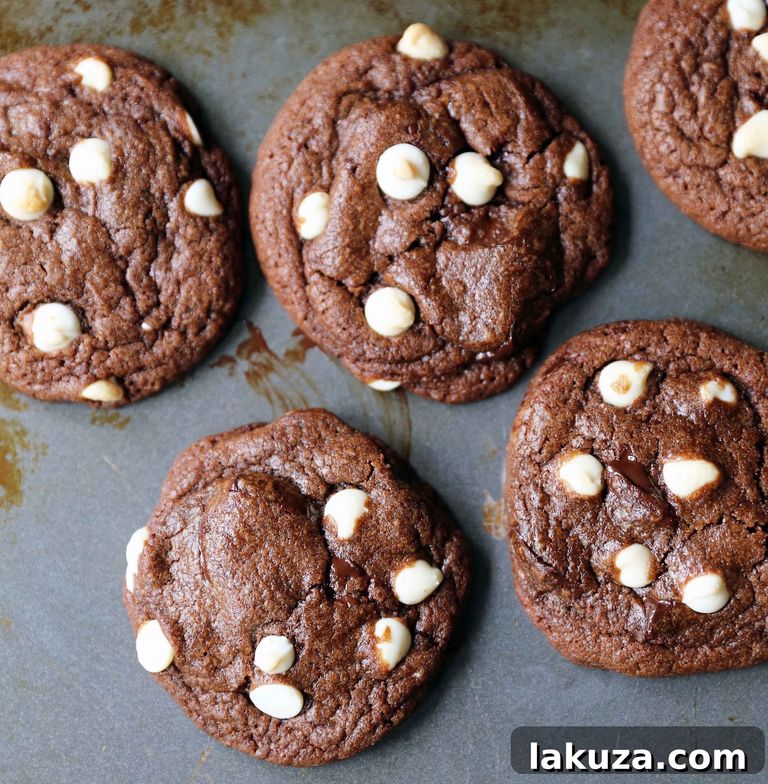 Hand reaching for a perfect Triple Chocolate Chip Cookie