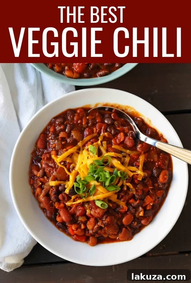 The BEST Veggie Chili Recipe: A vibrant, wholesome, and easy-to-make vegetarian chili, loaded with six delicious vegetables and three kinds of beans in a rich, spicy tomato sauce. Perfect for a healthy, comforting meal. #chili #veggiechili #vegetarian #chilirecipe