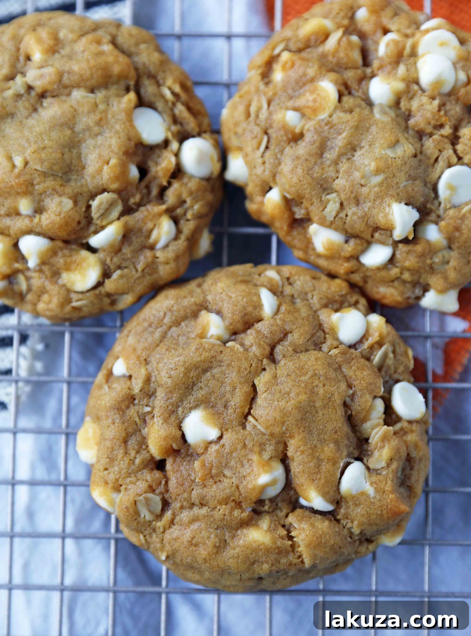 Autumn Spiced Pumpkin White Chocolate Chip Cookies 3 A plate stacked high with freshly baked Pumpkin White Chocolate Chip Cookies