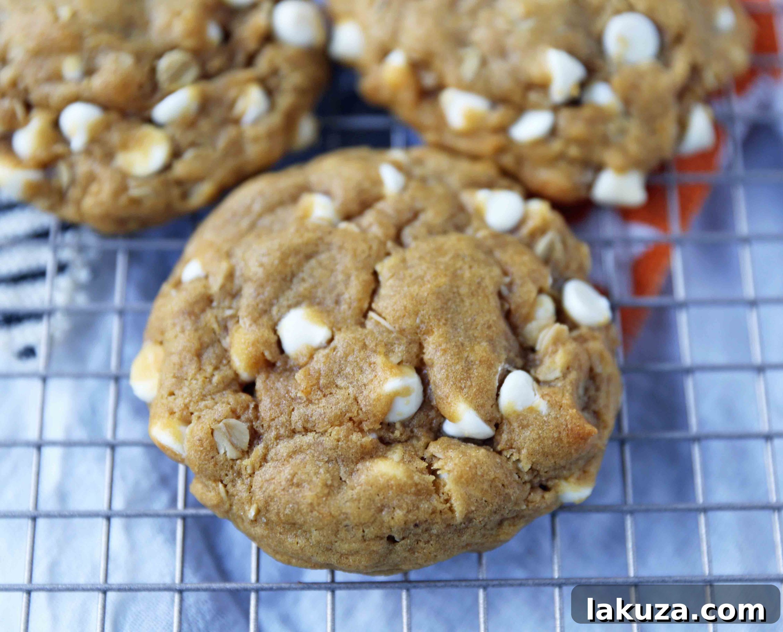 Autumn Spiced Pumpkin White Chocolate Chip Cookies 4 Ingredients for pumpkin cookies laid out, showcasing the white chocolate chips