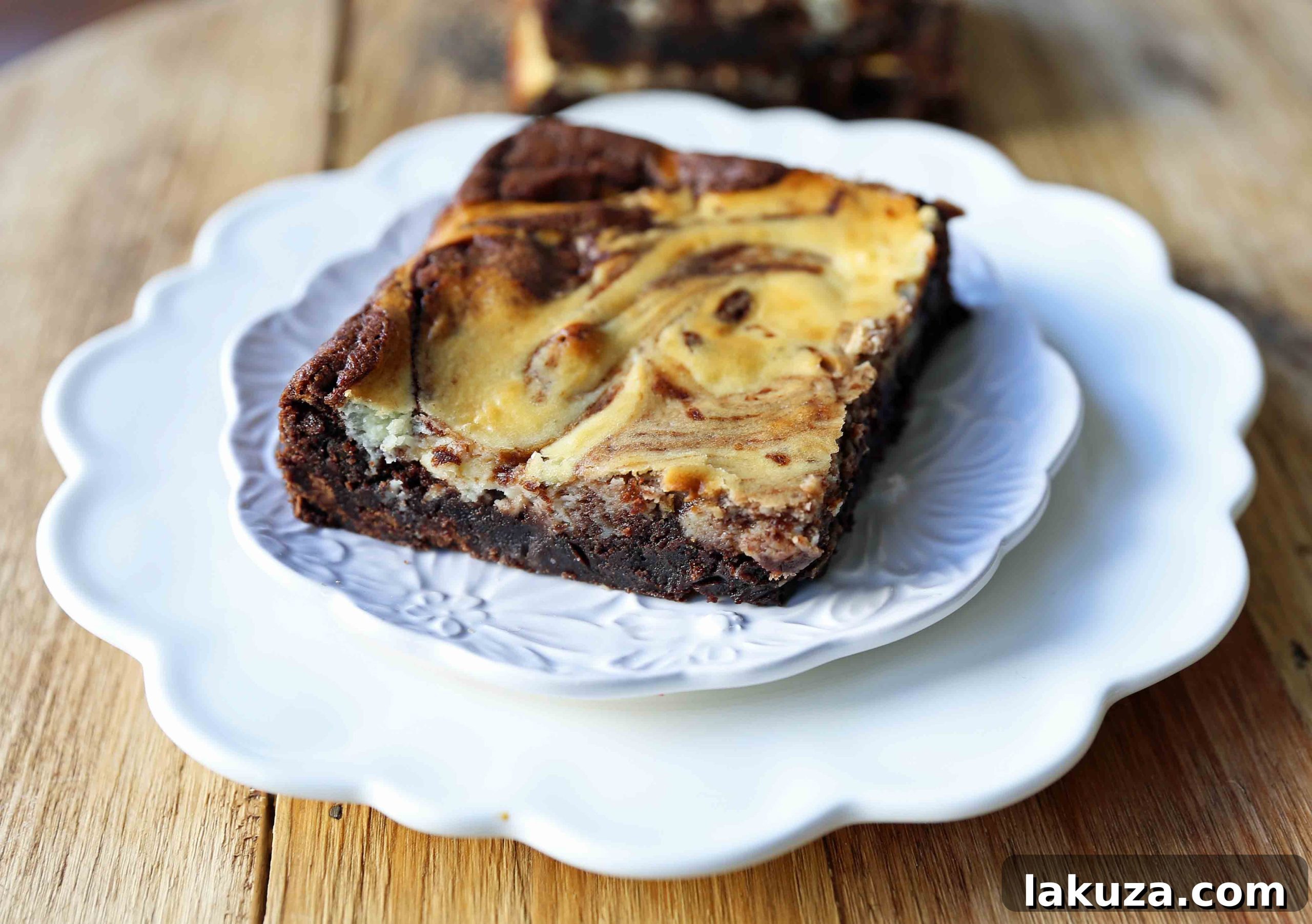Decadent Cheesecake Brownies 4 A freshly baked pan of cream cheese brownies, showing the artistic swirl pattern before cutting.