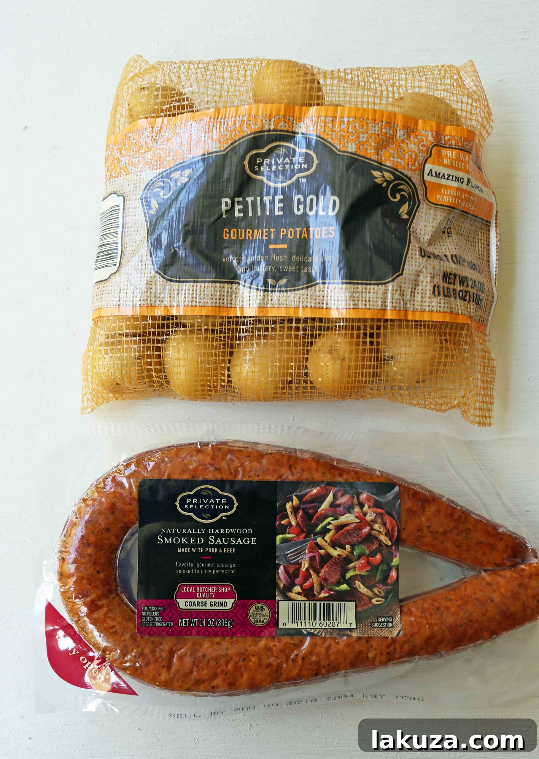 Hearty Sausage and Potato Foil Meals 5 Sausage Potato Foil Packets laid out on aluminum foil with all ingredients before sealing. Features hardwood smoked sausage, gold potatoes, red onion, and butter. Easy and delicious for oven or grill cooking. #foilpacketrecipes #sausageandpotatoes #dinnerprep #onepanmeal