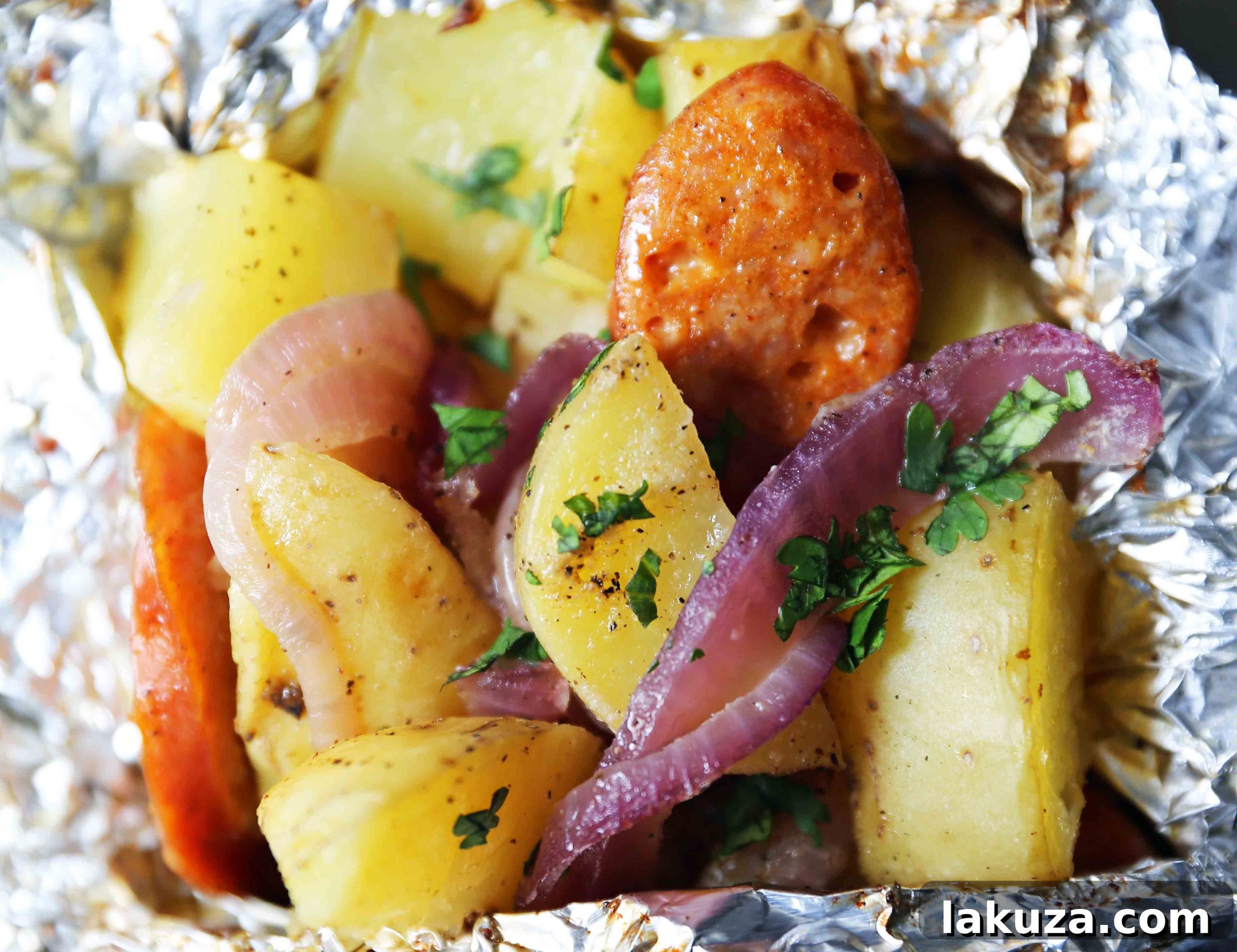 Hearty Sausage and Potato Foil Meals 6 Opened Sausage Potato Foil Packets showing perfectly cooked sausage and tender potatoes, with steam rising, garnished with fresh parsley. Ready to serve as an easy and flavorful dinner. #cookedfoilpackets #sausagepotatorecipe #quickdinner #healthyfood