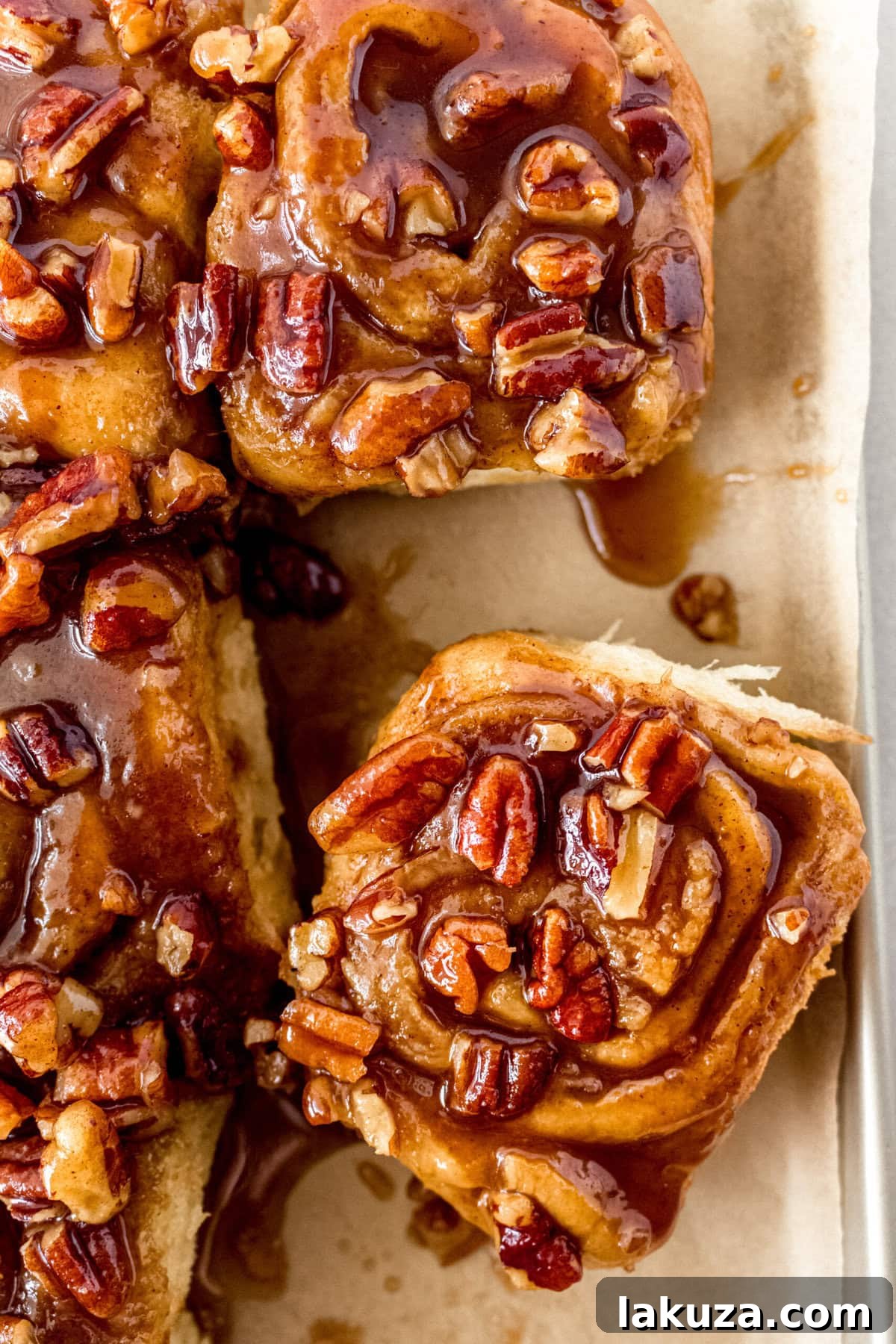 Caramel pecan sticky buns also known as caramel pecan rolls are homemade sweet rolls filled with a brown sugar cinnamon filling and topped with a rich caramel sauce and pecans. Sweet, nutty, and rich, this is the best sticky bun recipe!