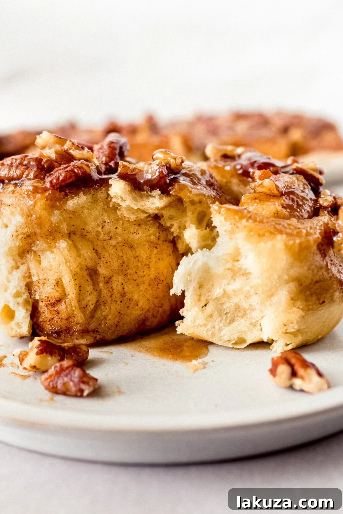 Caramel pecan sticky buns also known as caramel pecan rolls are homemade sweet rolls filled with a brown sugar cinnamon filling and topped with a rich caramel sauce and pecans. Sweet, nutty, and rich, this is the best sticky bun recipe!