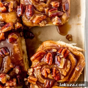 Caramel pecan sticky buns also known as caramel pecan rolls are homemade sweet rolls filled with a brown sugar cinnamon filling and topped with a rich caramel sauce and pecans. Sweet, nutty, and rich, this is the best sticky bun recipe!