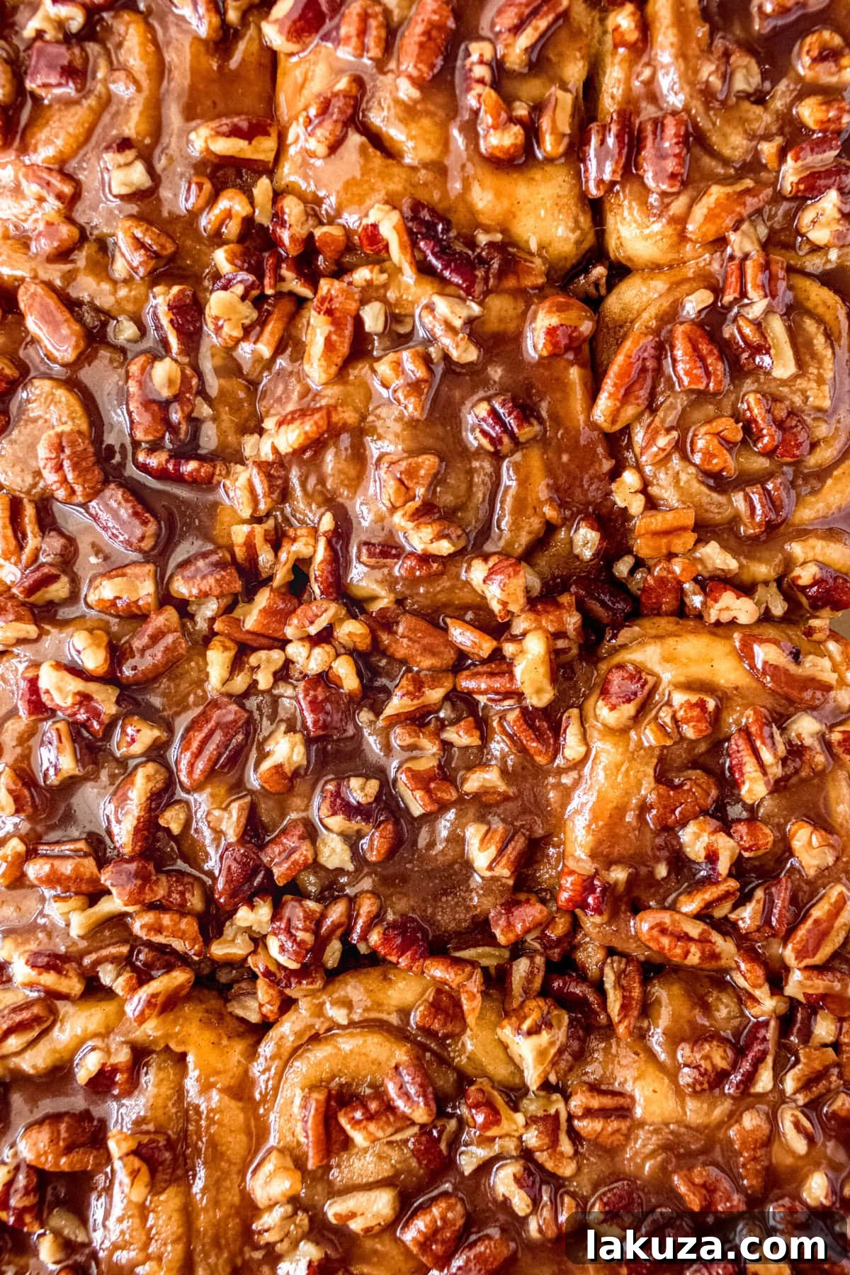 Caramel pecan sticky buns also known as caramel pecan rolls are homemade sweet rolls filled with a brown sugar cinnamon filling and topped with a rich caramel sauce and pecans. Sweet, nutty, and rich, this is the best sticky bun recipe!