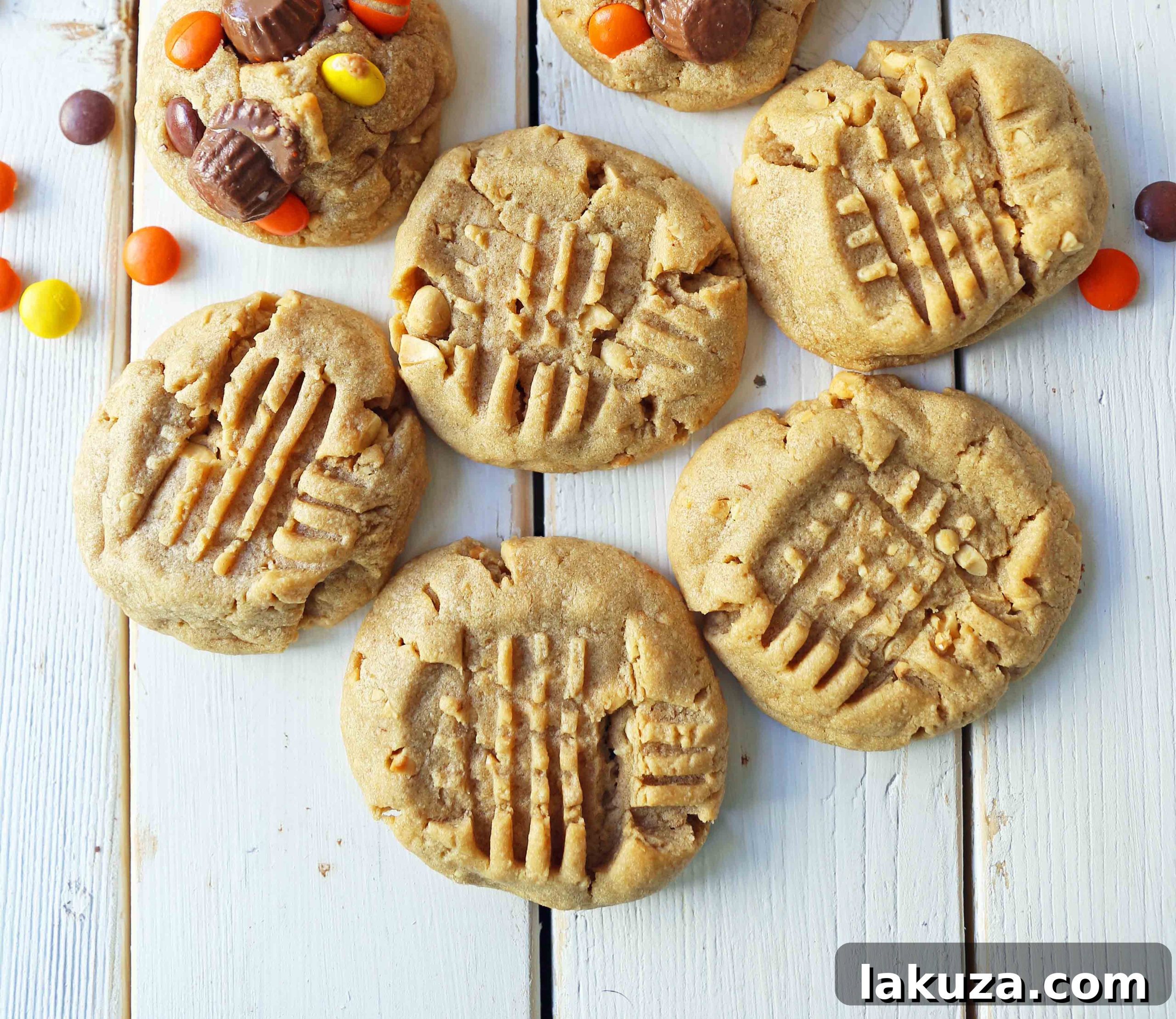 Close-up of freshly baked Soft Chewy Peanut Butter Cookies with their signature crisscross pattern, highlighting the golden edges and soft center.