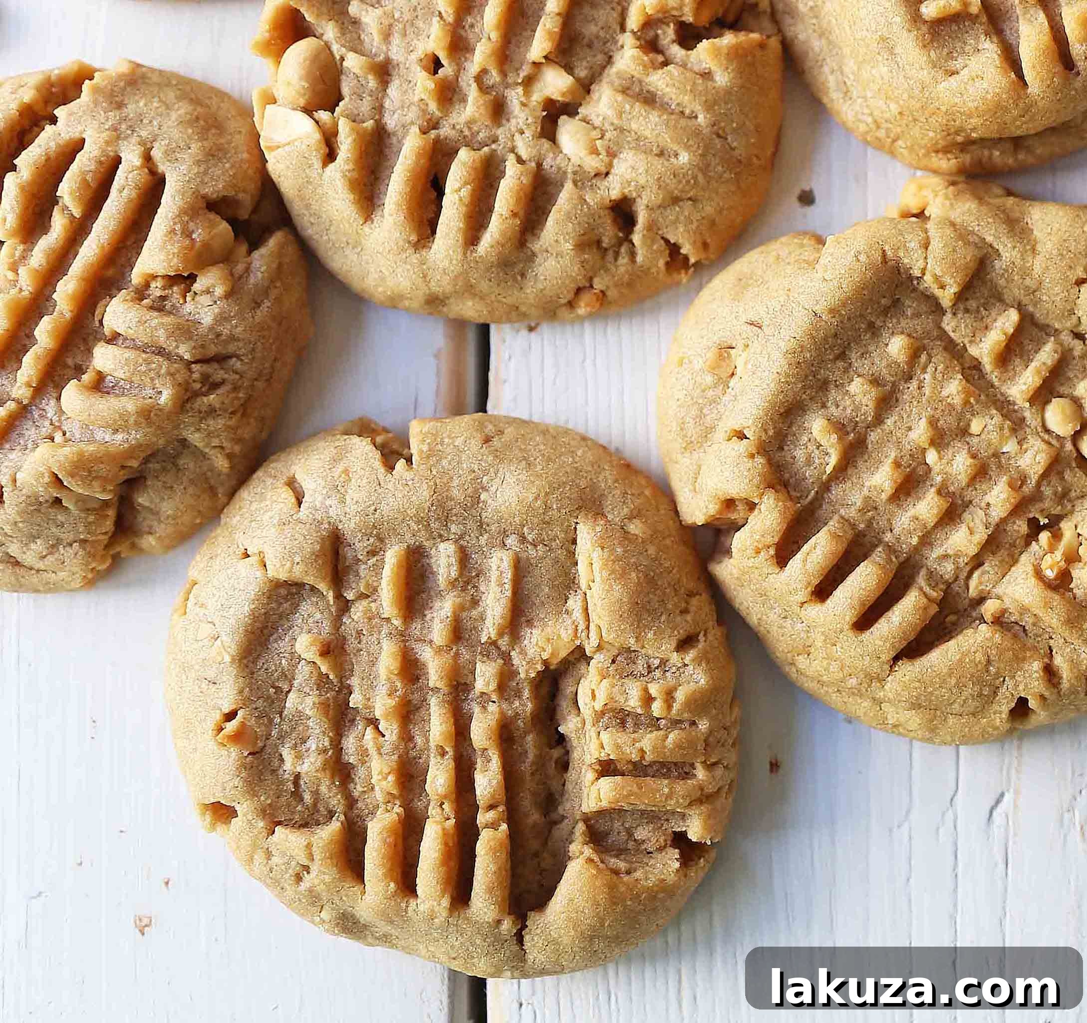 Stack of fresh, soft, and chewy peanut butter cookies, showing their perfect texture and golden color, ready to be enjoyed.