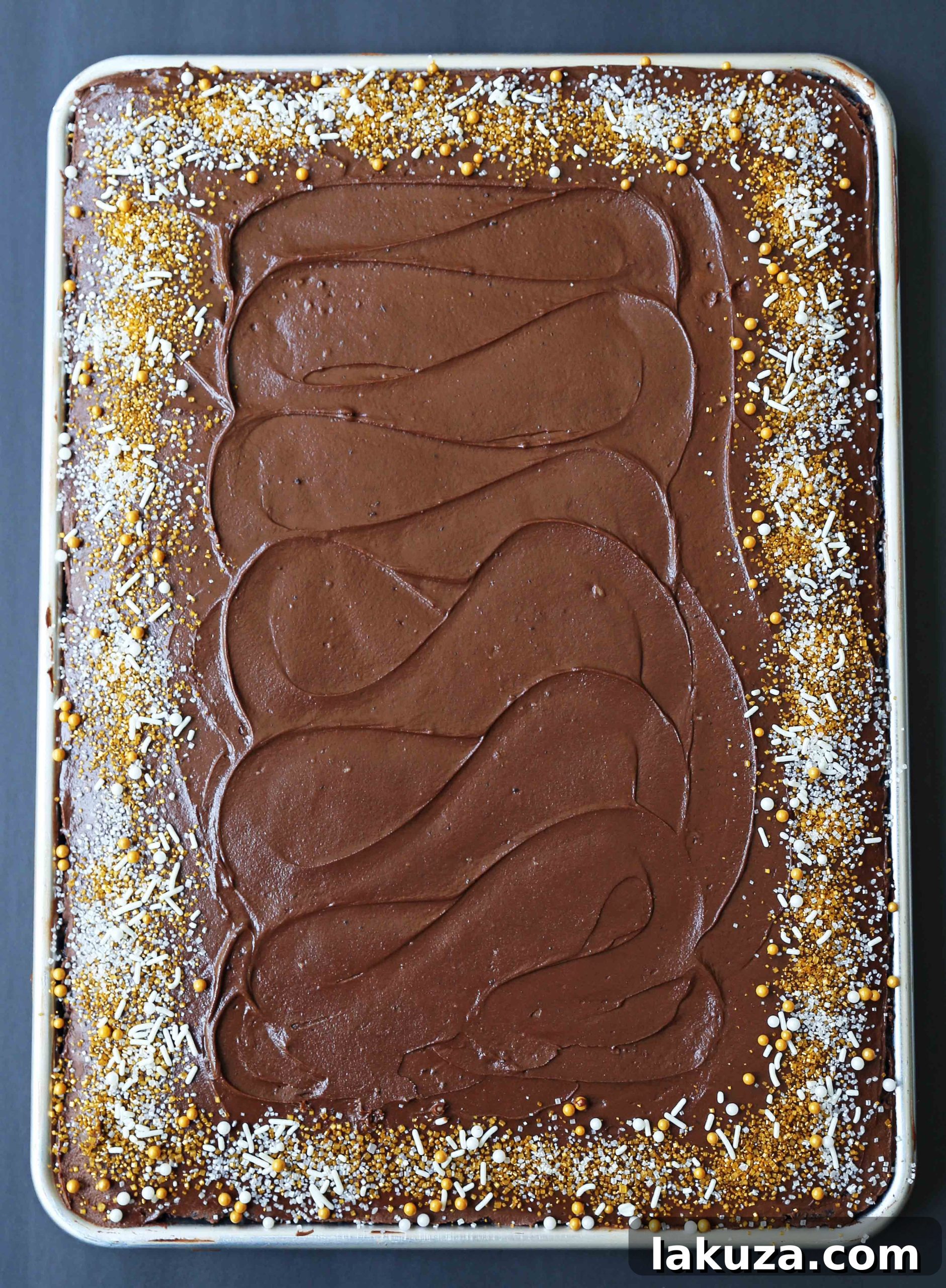 Perfectly frosted chocolate sheet cake squares, ready to serve. An ideal dessert for parties and family gatherings, simple and delicious.