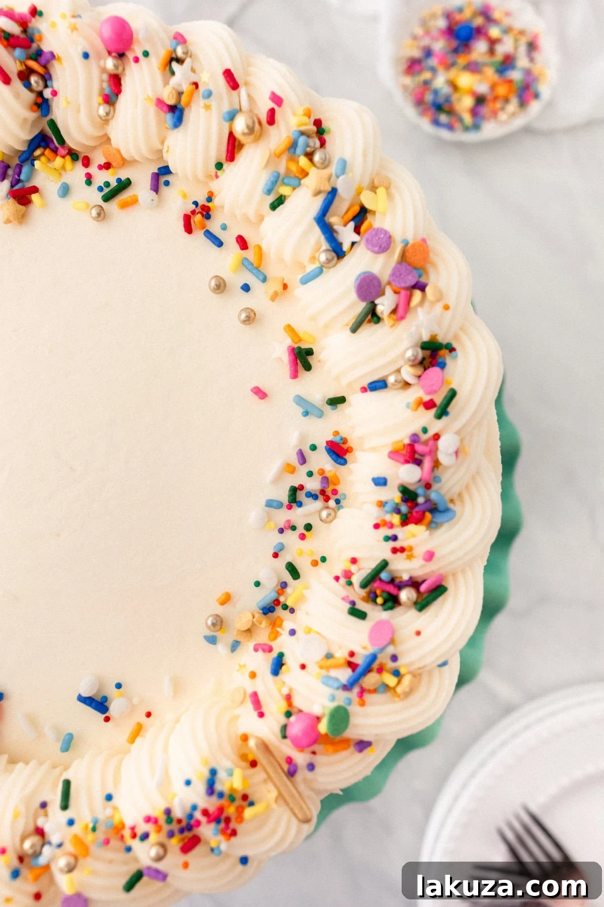Joyful Sprinkle Celebration 6 A vibrant, multi-layered Funfetti cake, expertly frosted and decorated with an abundance of rainbow sprinkles, showcased against a neutral background.