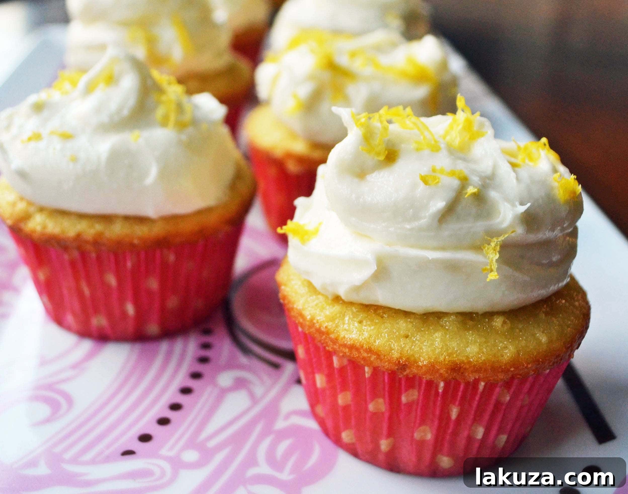 Finished Italian Lemon Cupcakes with Sweet Ricotta Cream and lemon zest garnish