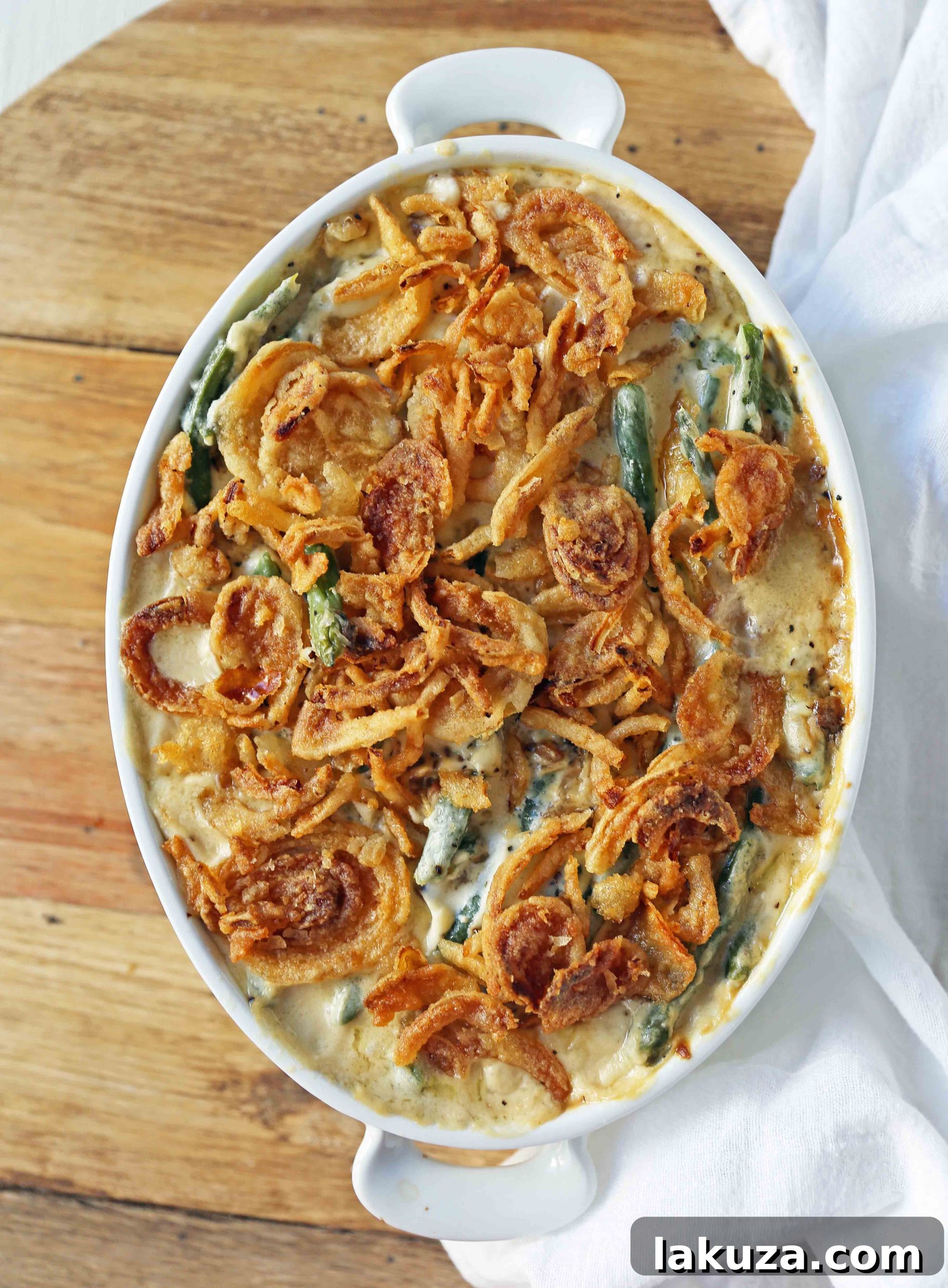 Close-up of the creamy, rich sauce for Green Bean Casserole, showcasing the texture and inviting warmth.