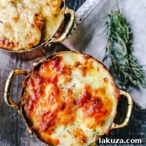 Cheesy Potatoes Au Gratin Homemade cheesy scalloped potatoes with a rich cream sauce and melted cheddar cheese. The perfect potato side dish recipe!