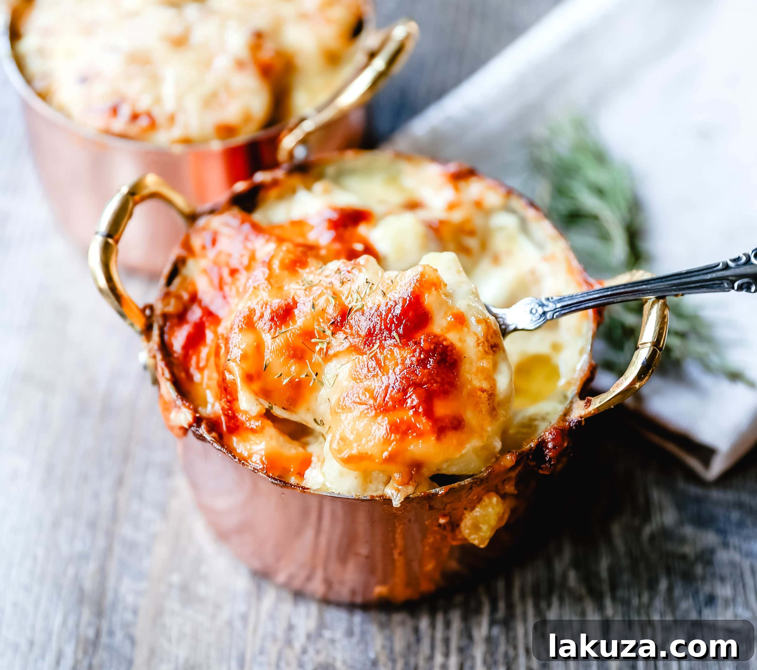 Mouthwatering Cheesy Potato Gratin 4 Homemade cheesy scalloped potatoes au gratin, presented in a rustic baking dish, highlighting the golden cheese topping and creamy texture. Ideal for any gathering.