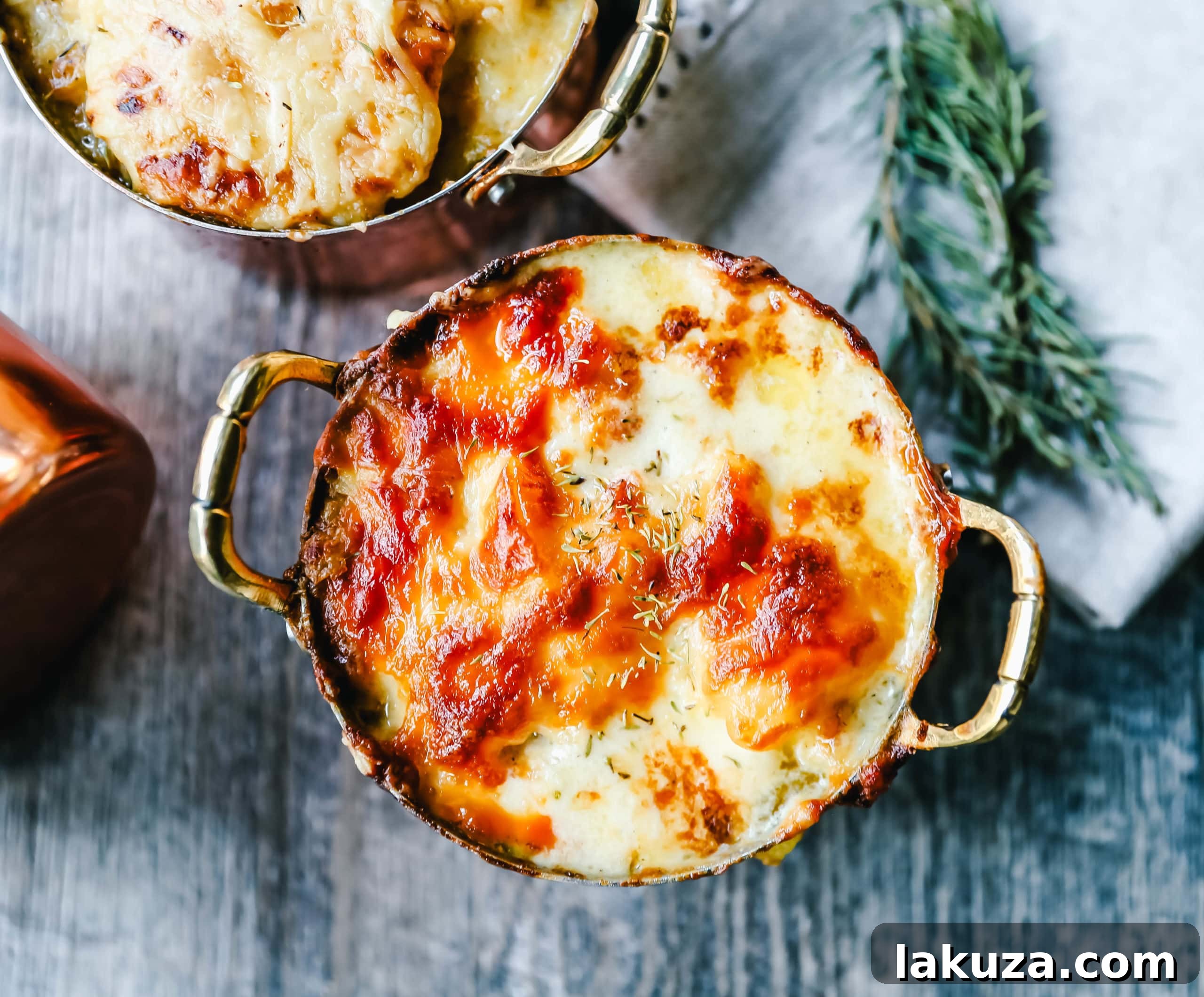 Mouthwatering Cheesy Potato Gratin 5 A serving of cheesy potatoes au gratin, showing the generous layers of potatoes and cheese, perfectly baked to a golden brown.