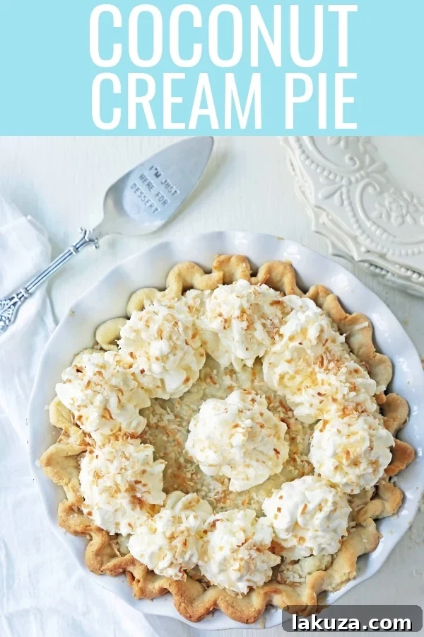 A stunning vertical shot of the Coconut Cream Pie, showing its height and luscious layers, ready to be enjoyed.